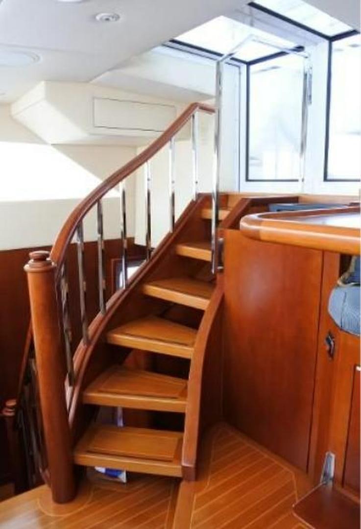 a wooden staircase in a house aboard MY LADY ALASKA Yacht for Sale