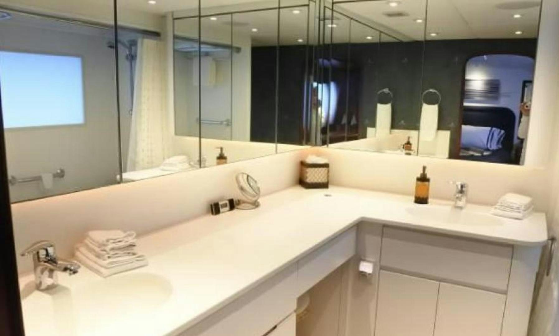 a bathroom with a large mirror aboard MY LADY ALASKA Yacht for Sale