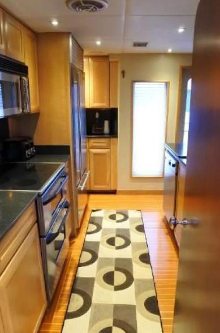 a kitchen with a tile floor aboard MY LADY ALASKA Yacht for Sale