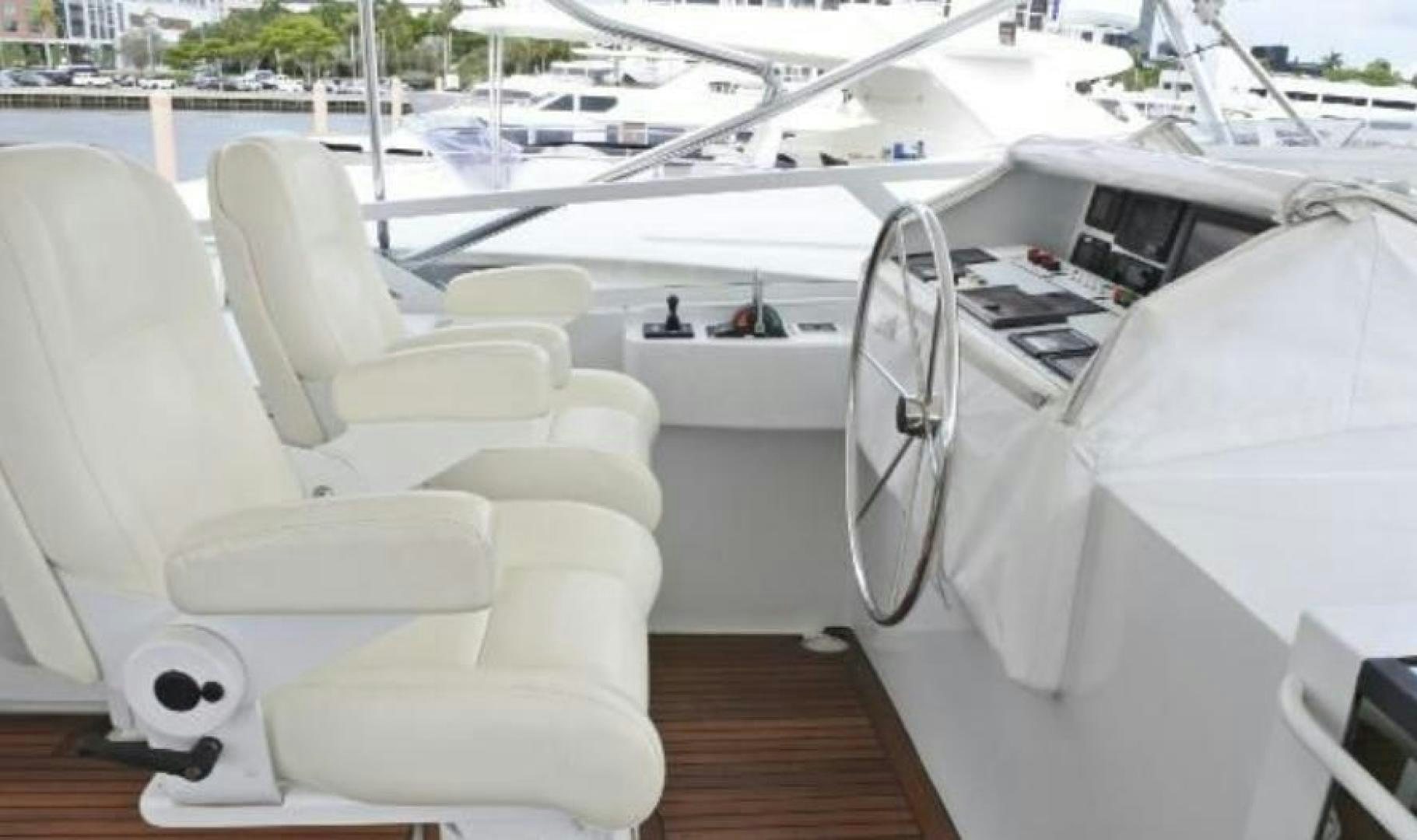a white yacht with a deck aboard MY LADY ALASKA Yacht for Sale