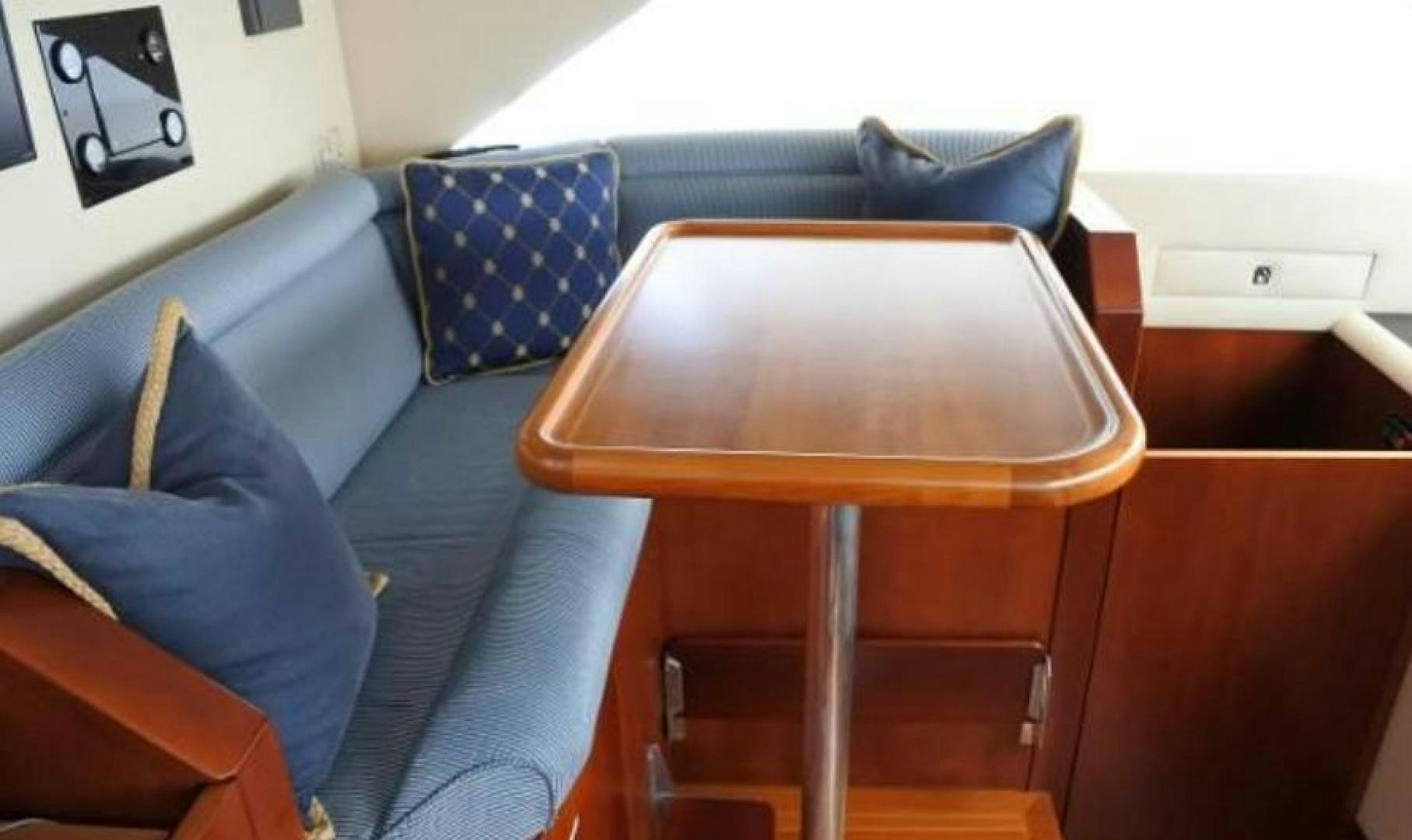 a couch and a chair in a room aboard MY LADY ALASKA Yacht for Sale