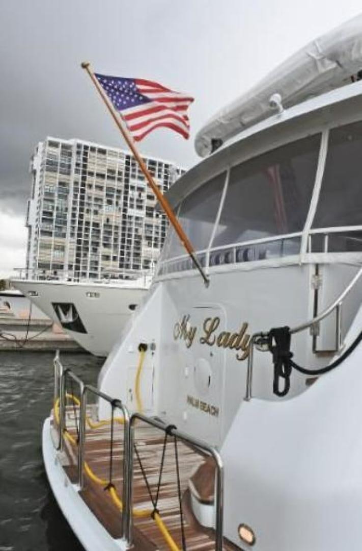a large white boat with a flag on it aboard MY LADY ALASKA Yacht for Sale