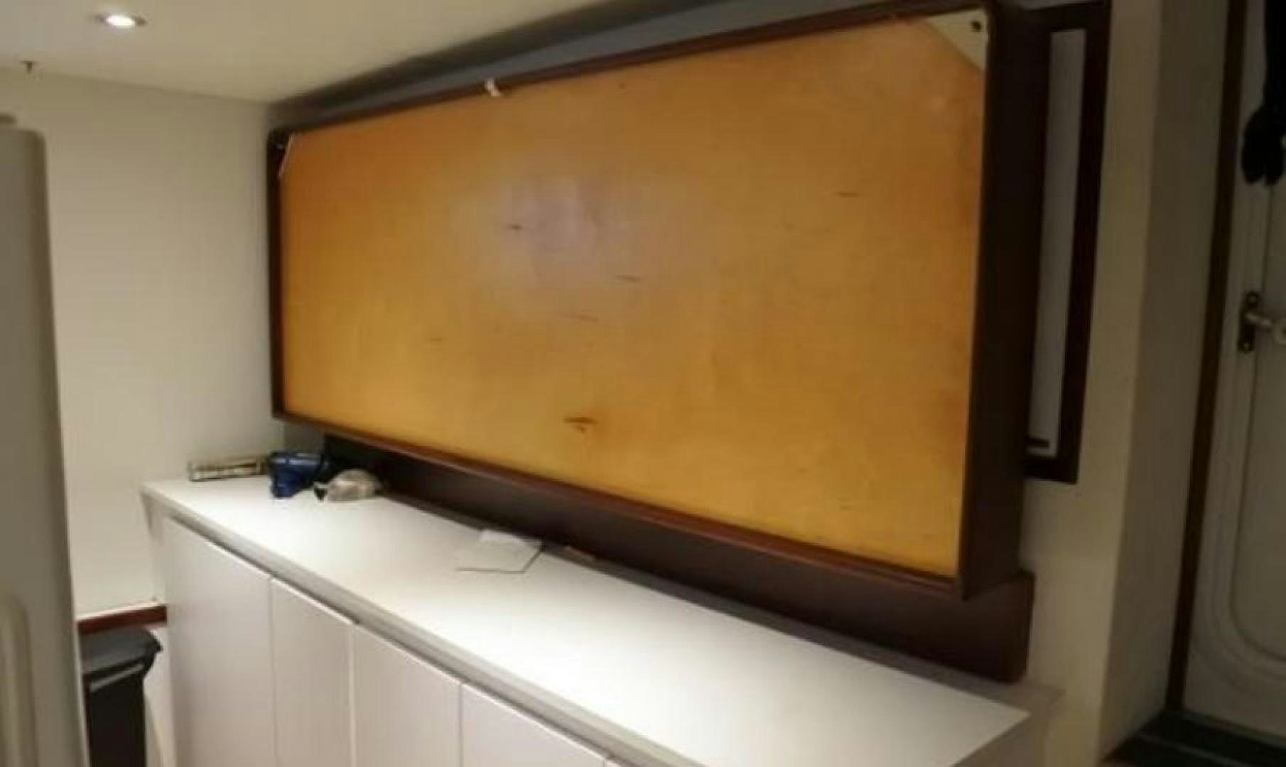 a white cabinet with a black door aboard MY LADY ALASKA Yacht for Sale