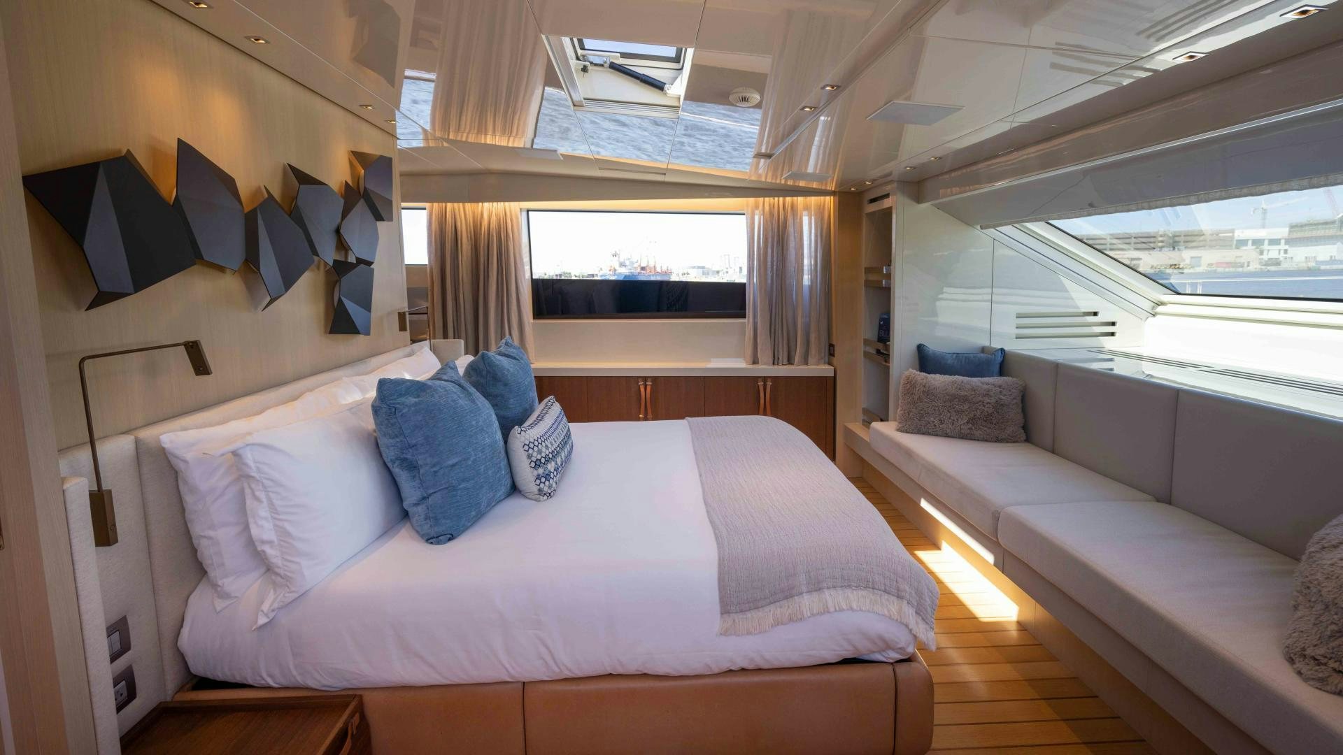 a room with a bed and a couch aboard NOTORIOUS Yacht for Sale