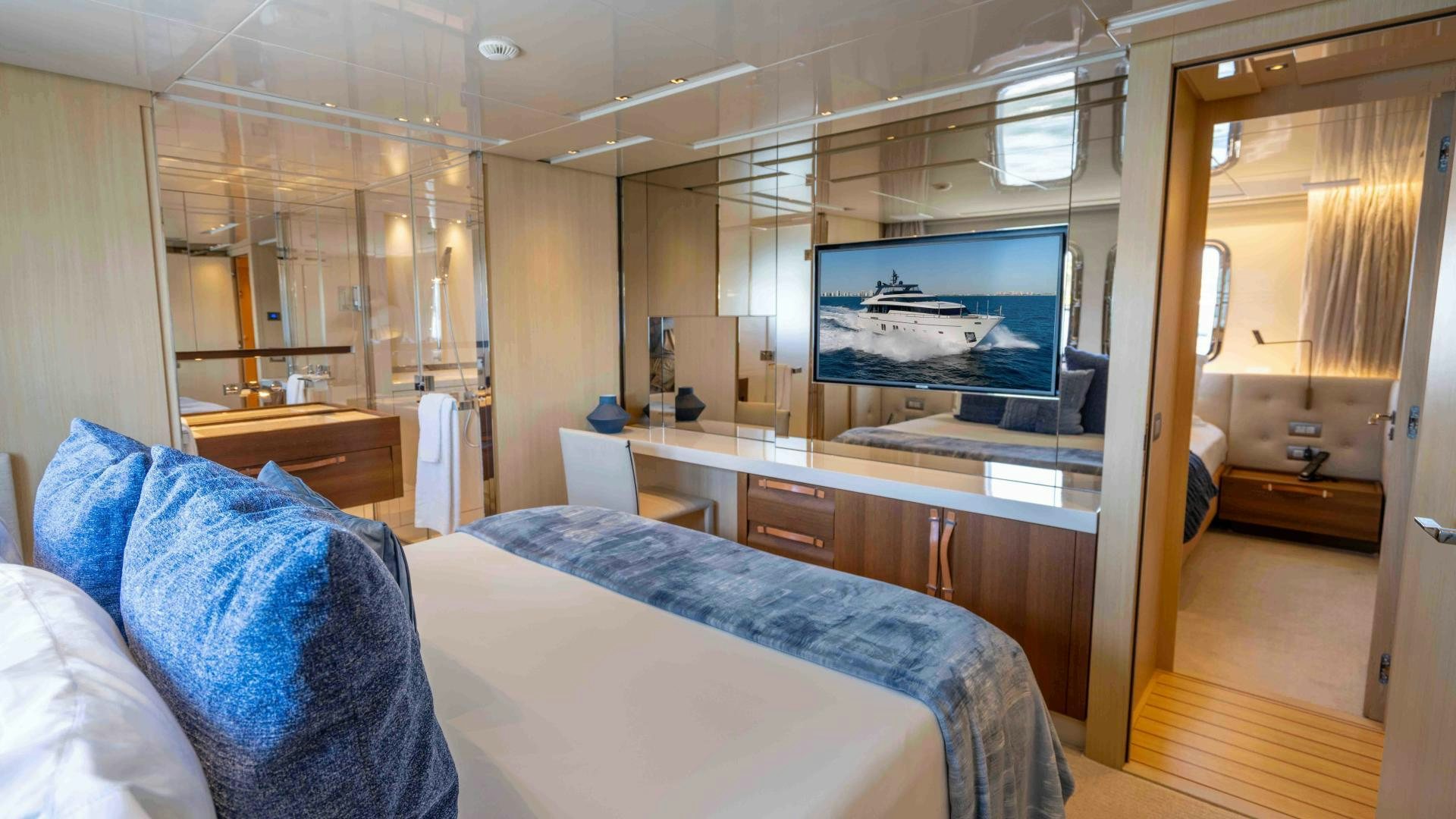 a room with a bed and a tv aboard NOTORIOUS Yacht for Sale
