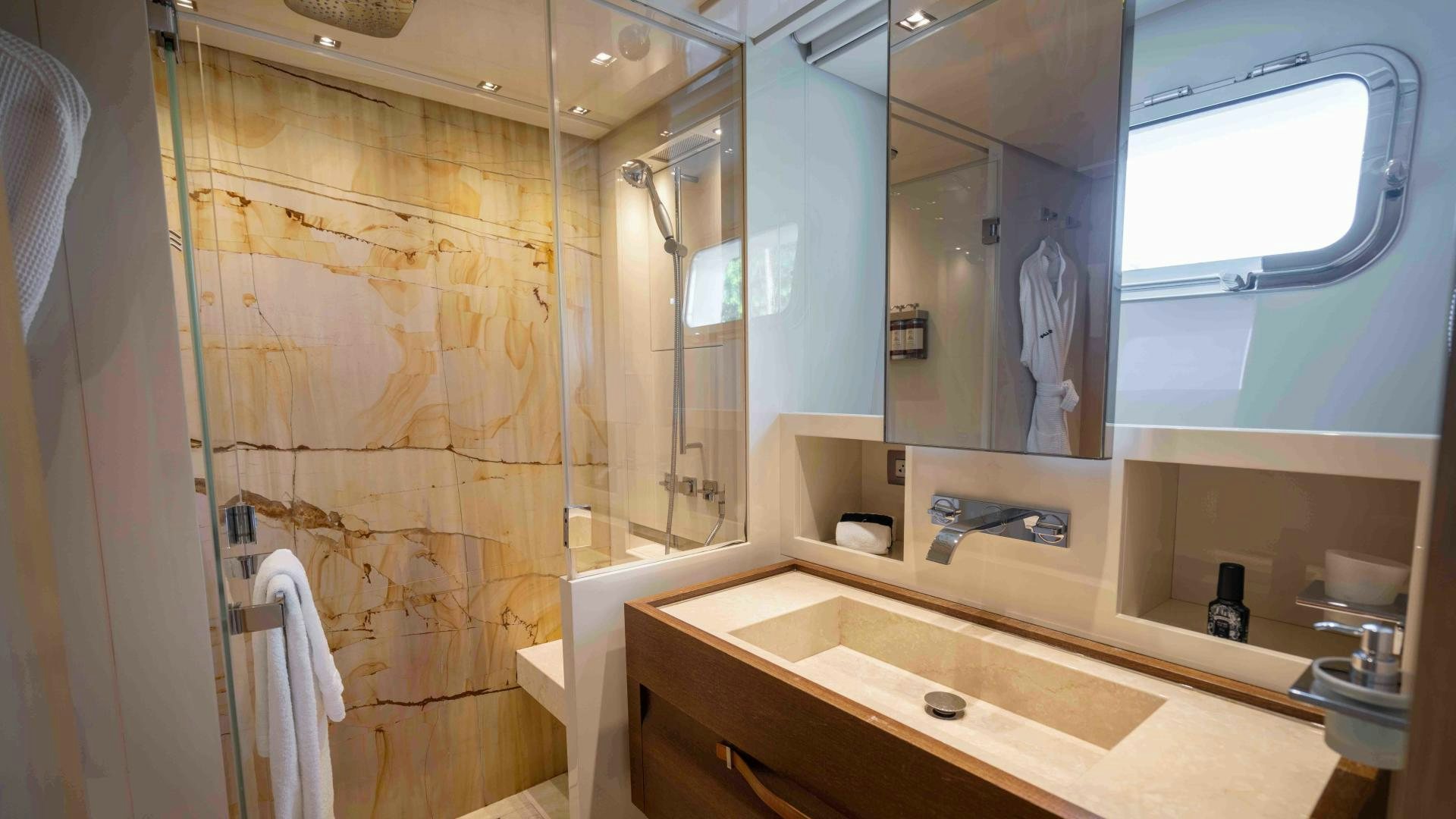 a bathroom with a large mirror aboard NOTORIOUS Yacht for Sale