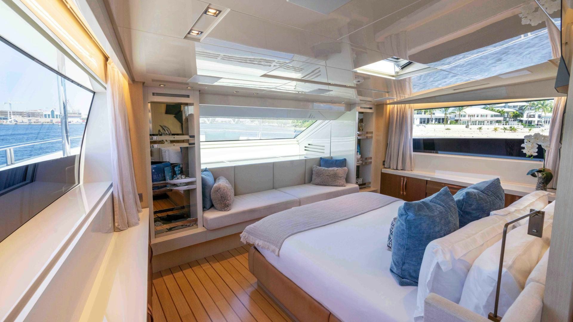 a room with a bed and a window aboard NOTORIOUS Yacht for Sale