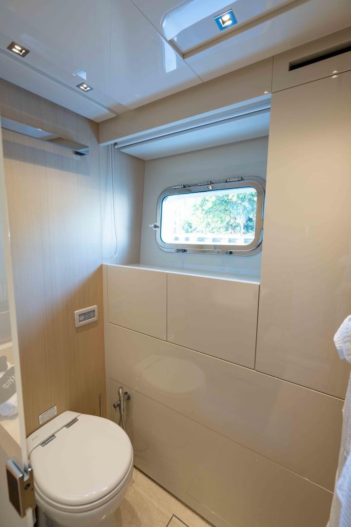 a bathroom with a window aboard NOTORIOUS Yacht for Sale