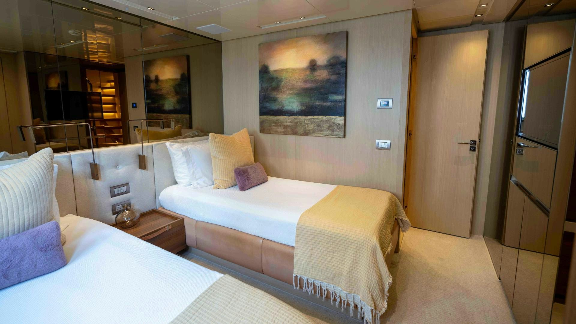 a room with two beds aboard NOTORIOUS Yacht for Sale