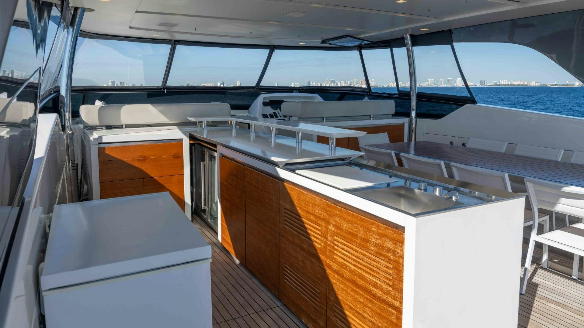 a room with a large window and a view of the water aboard NOTORIOUS Yacht for Sale