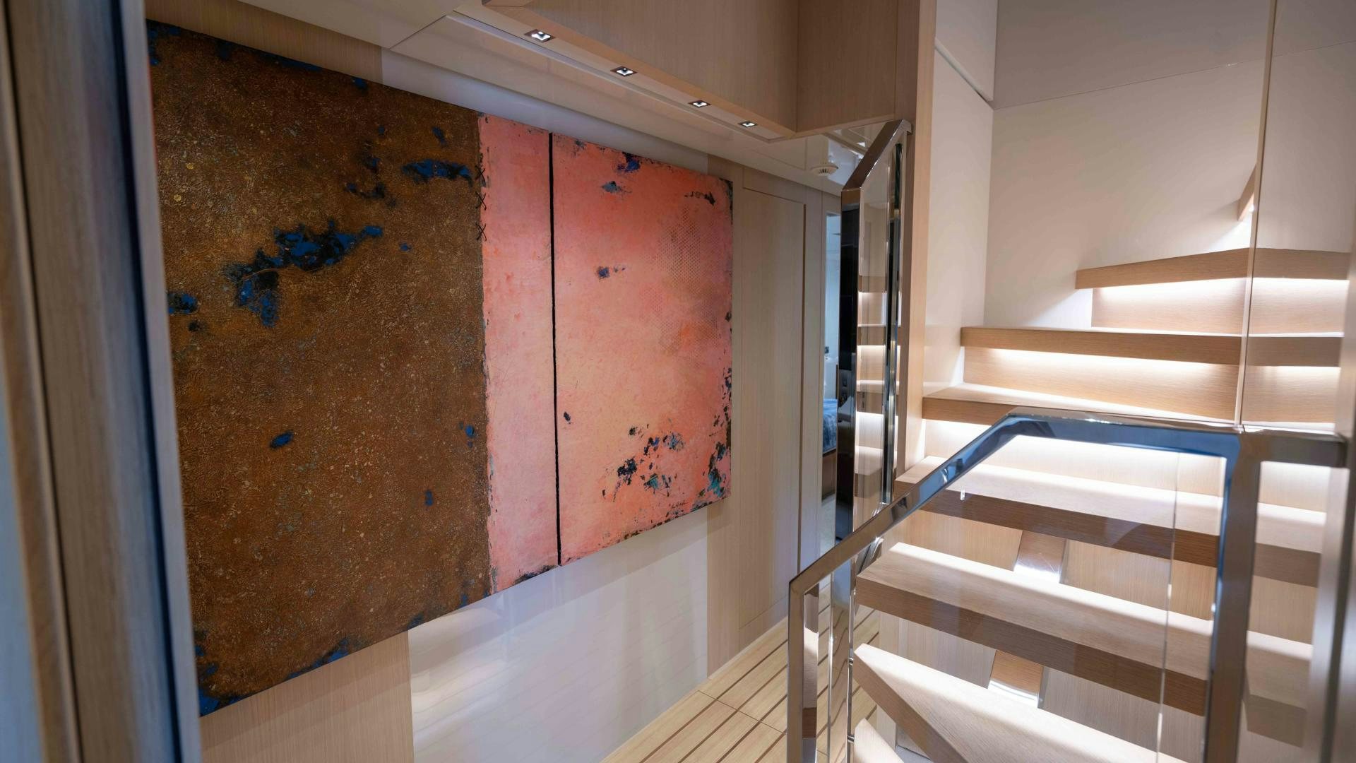 a red wall with a metal railing aboard NOTORIOUS Yacht for Sale