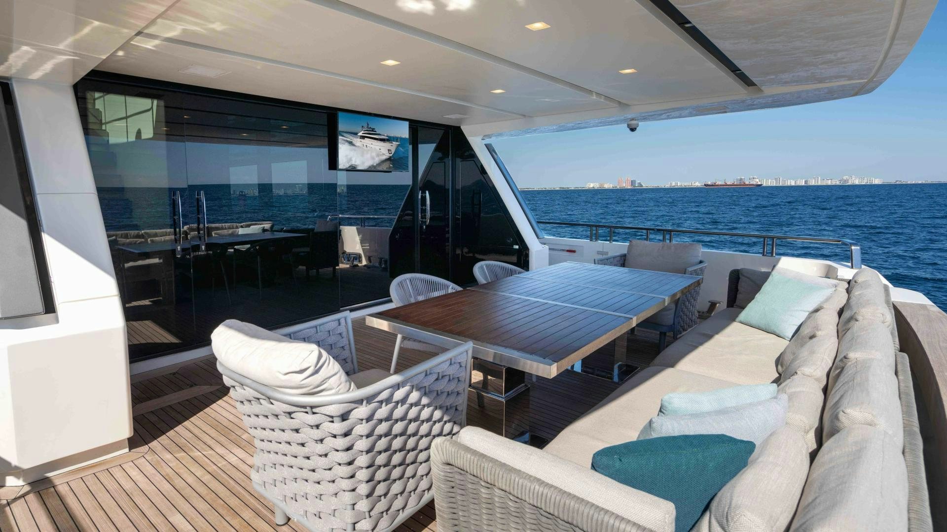 a large lounge area with a large pool and a large deck aboard NOTORIOUS Yacht for Sale