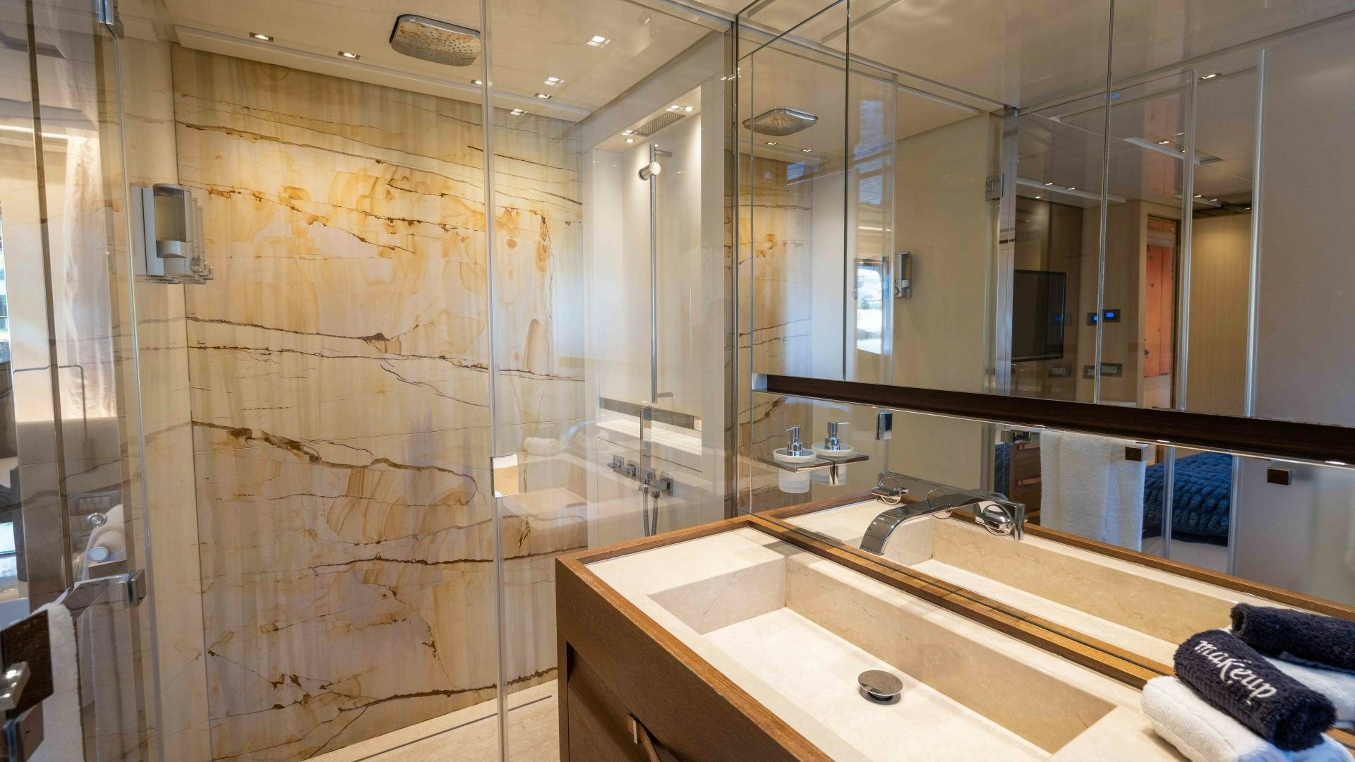 a bathroom with a large mirror aboard NOTORIOUS Yacht for Sale