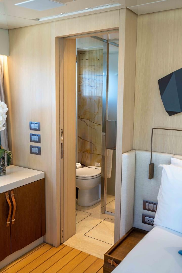 a bathroom with a glass shower aboard NOTORIOUS Yacht for Sale