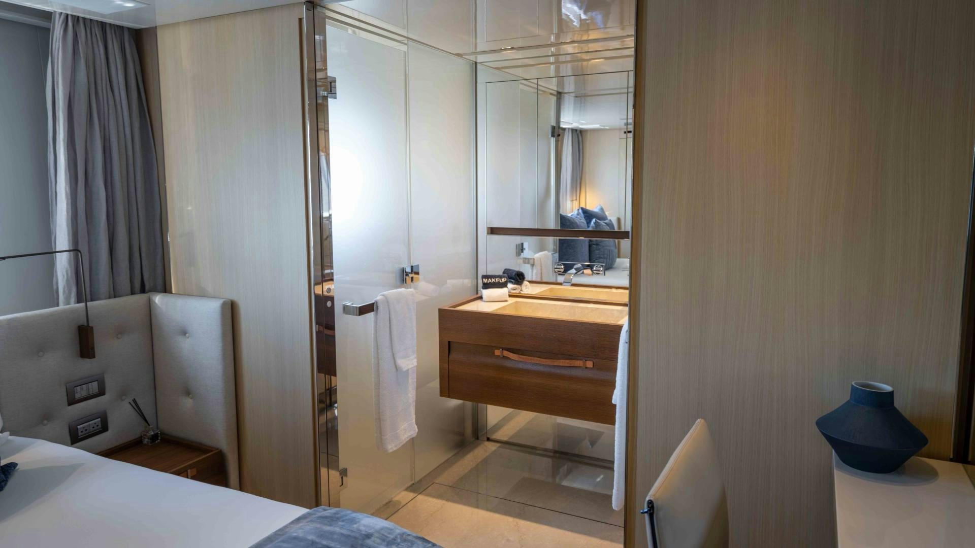 a bathroom with a shower and sink aboard NOTORIOUS Yacht for Sale