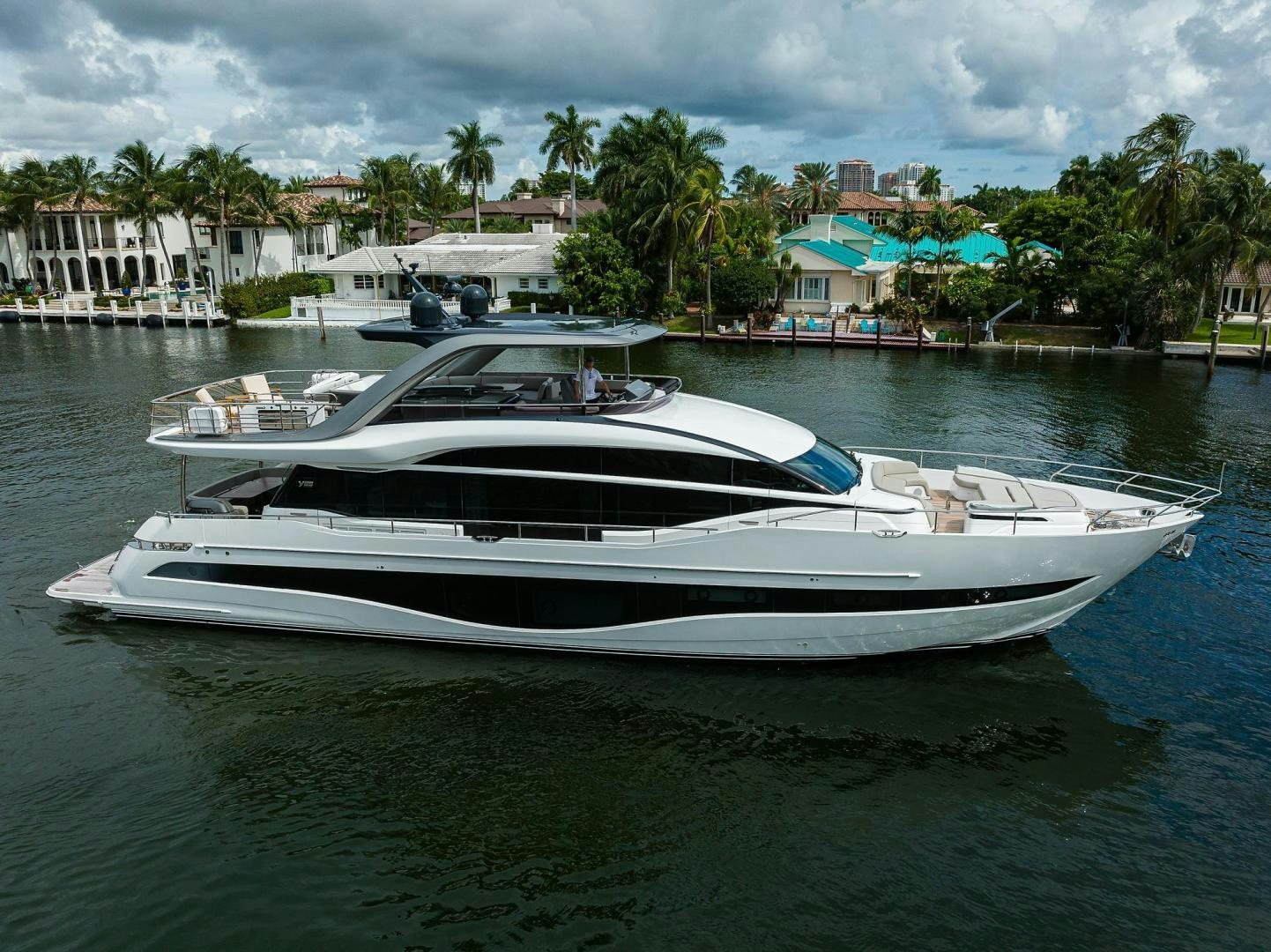 a white boat in the water aboard ESCAPE Yacht for Sale