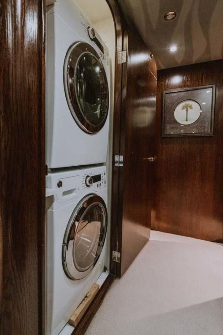 a room with a washing machine aboard SKY Yacht for Sale