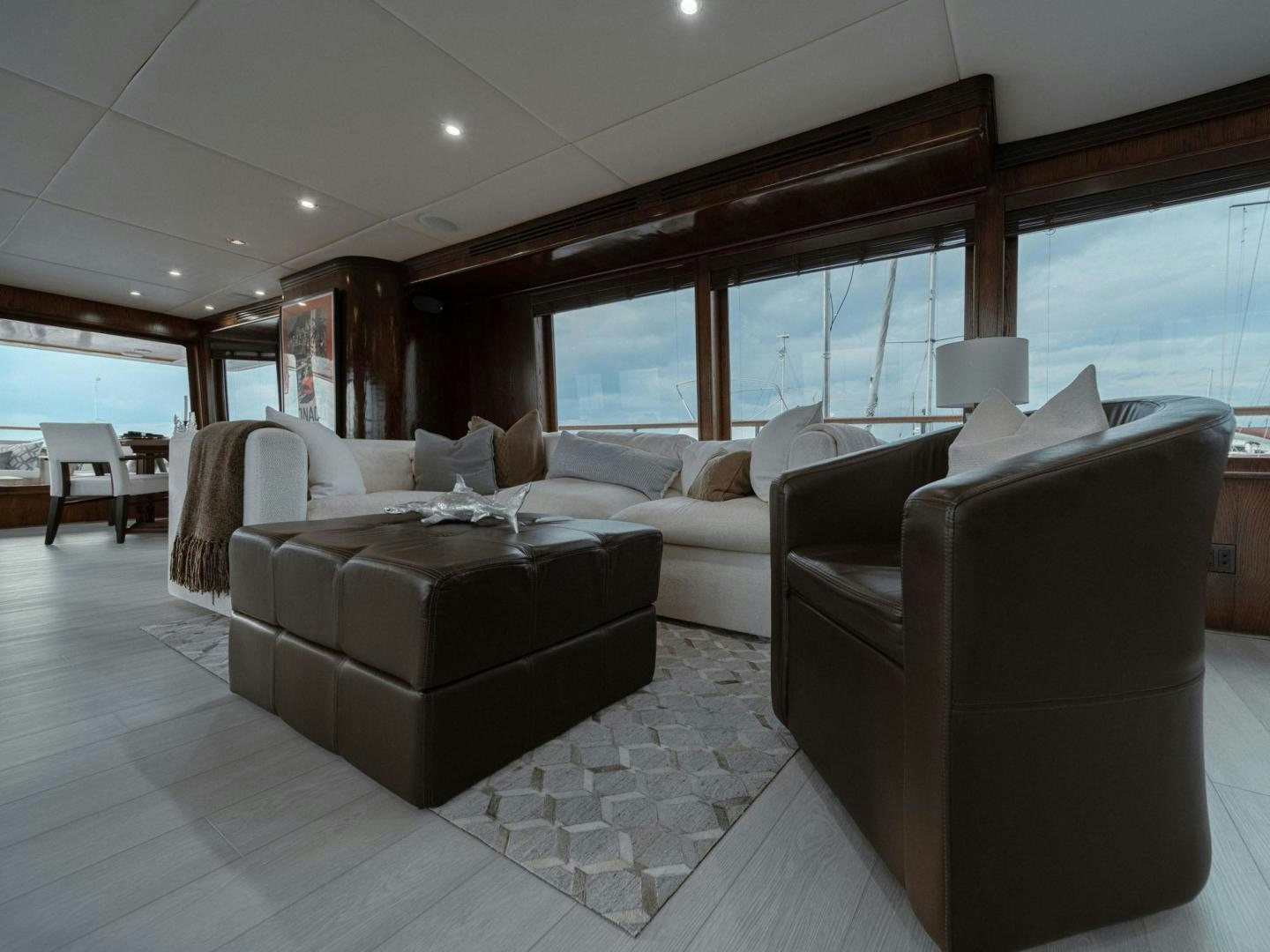 a large living room with a large window aboard SKY Yacht for Sale