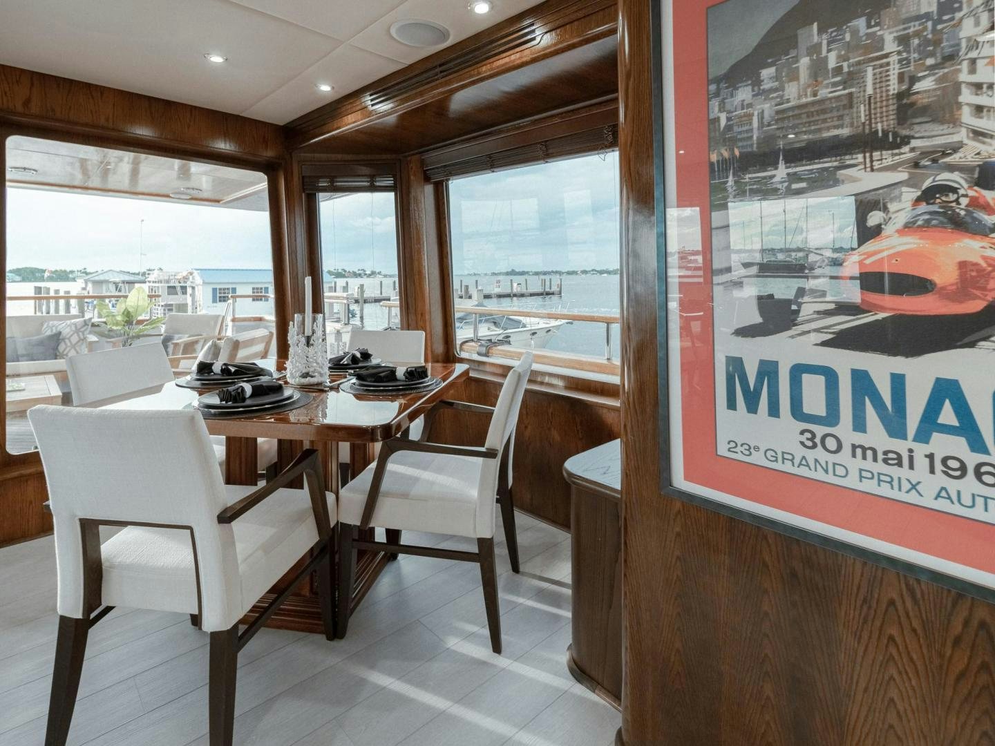 a restaurant with a table and chairs aboard SKY Yacht for Sale