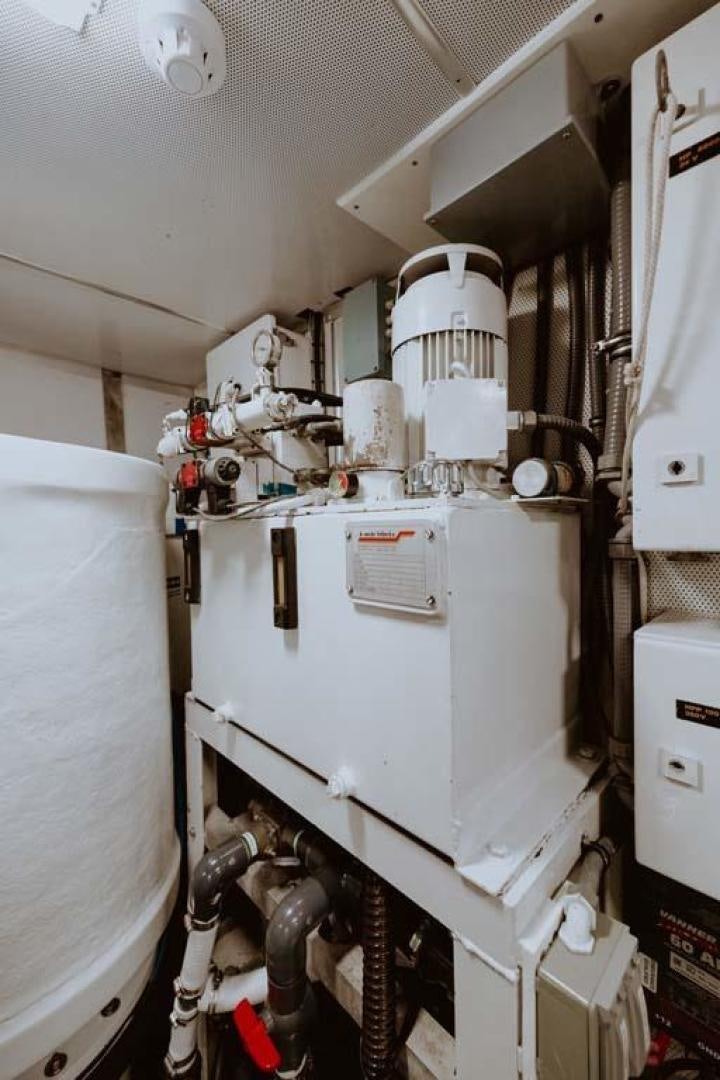 a large white machine aboard SKY Yacht for Sale