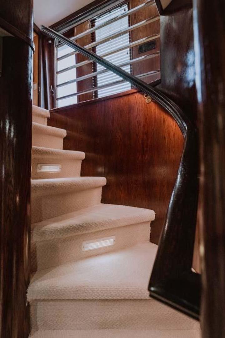 a staircase with a set of stairs aboard SKY Yacht for Sale