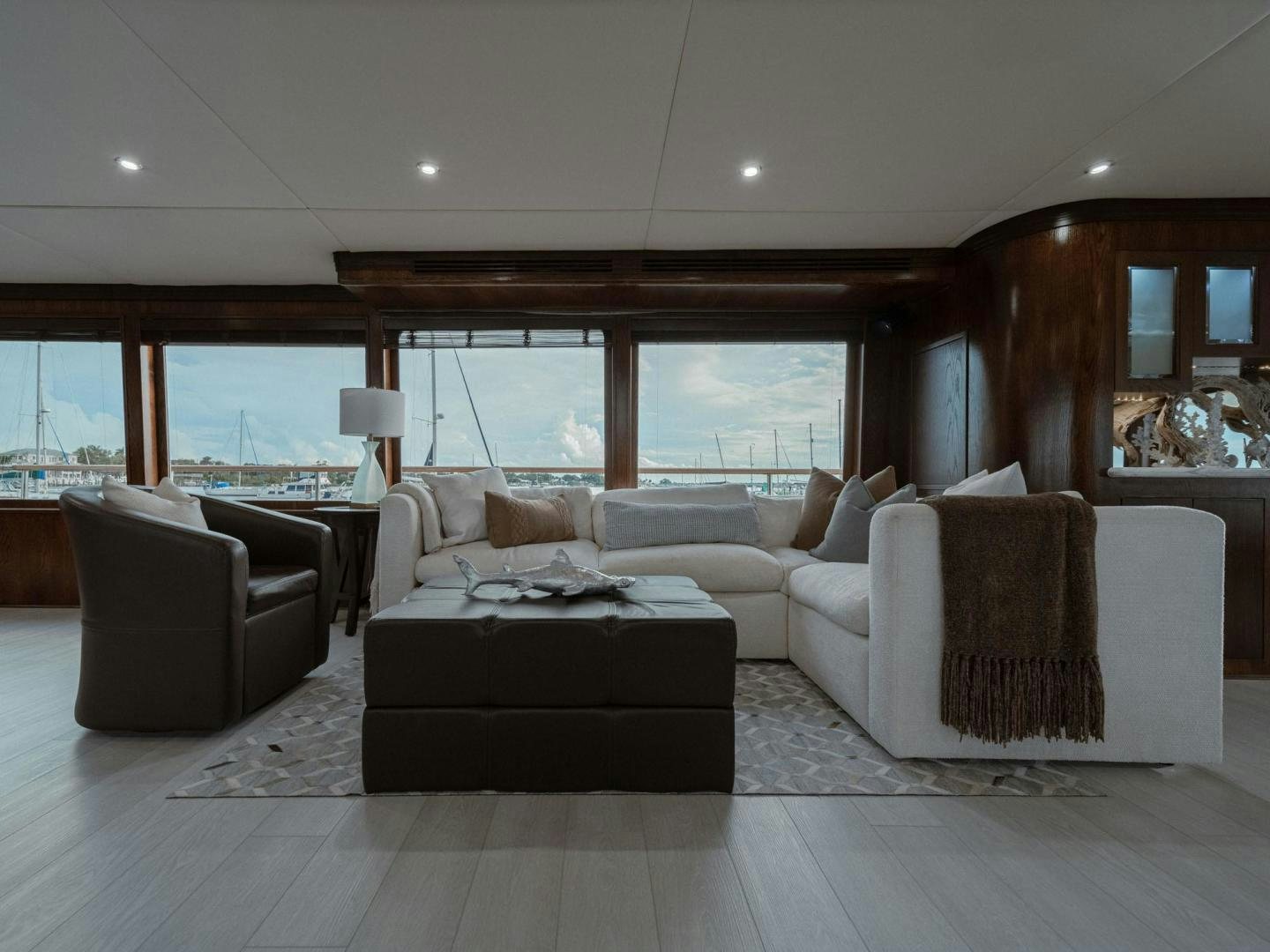 a living room with a large window aboard SKY Yacht for Sale