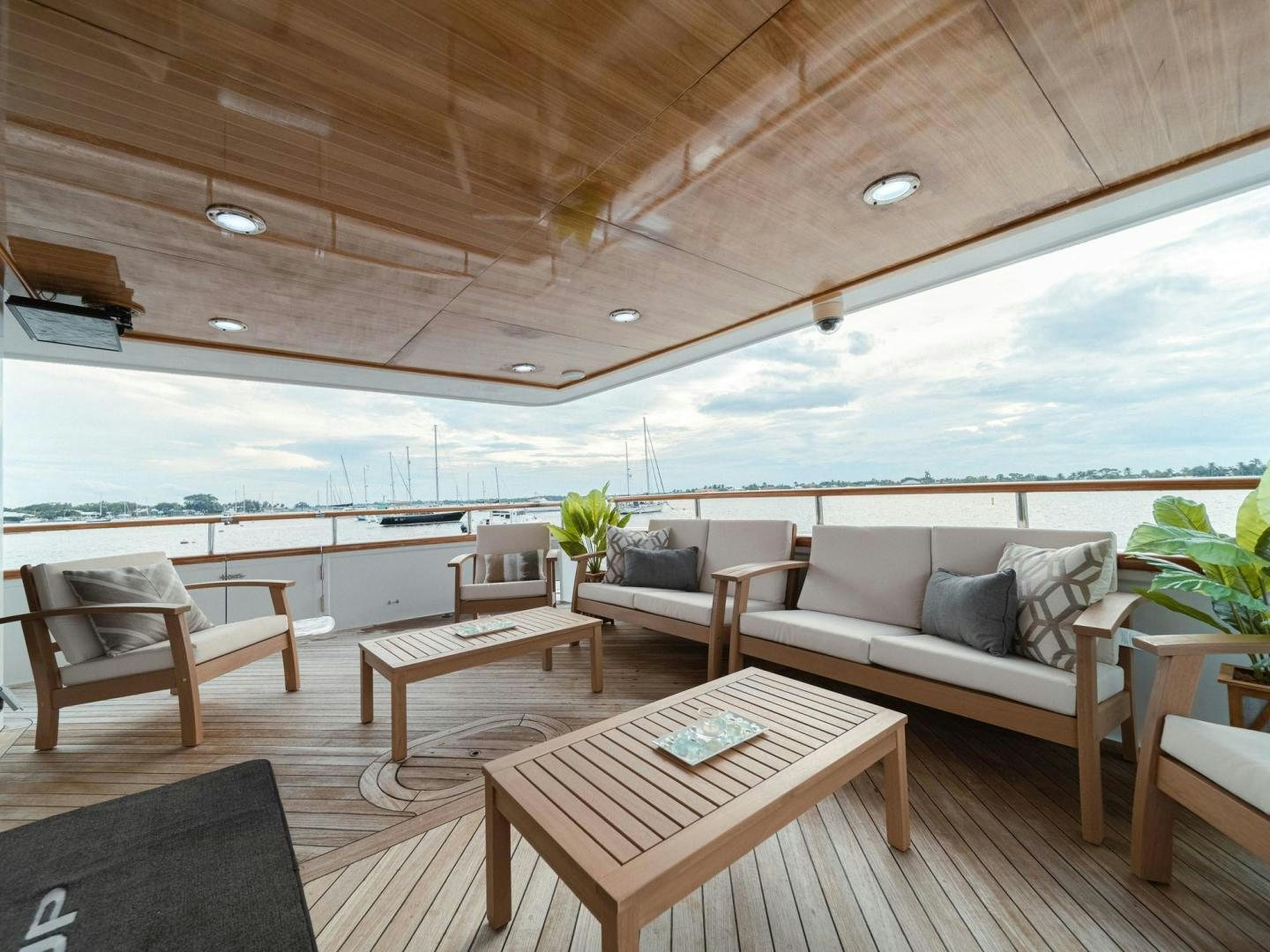 a living room with a couch and a table aboard SKY Yacht for Sale