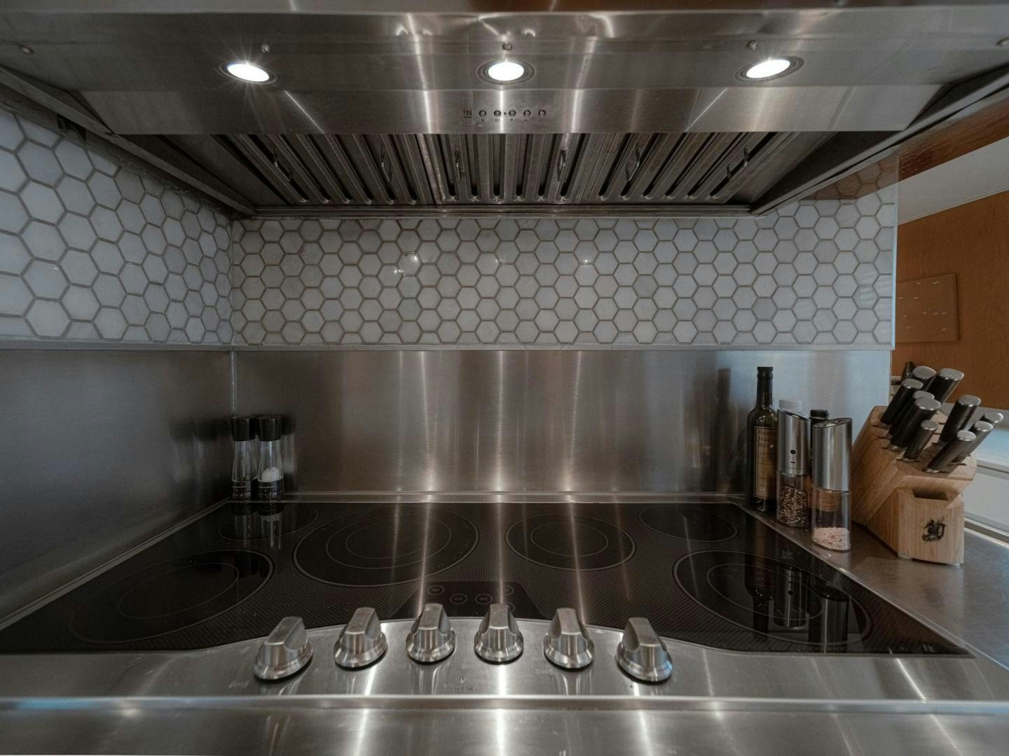 a kitchen with stainless steel appliances aboard SKY Yacht for Sale