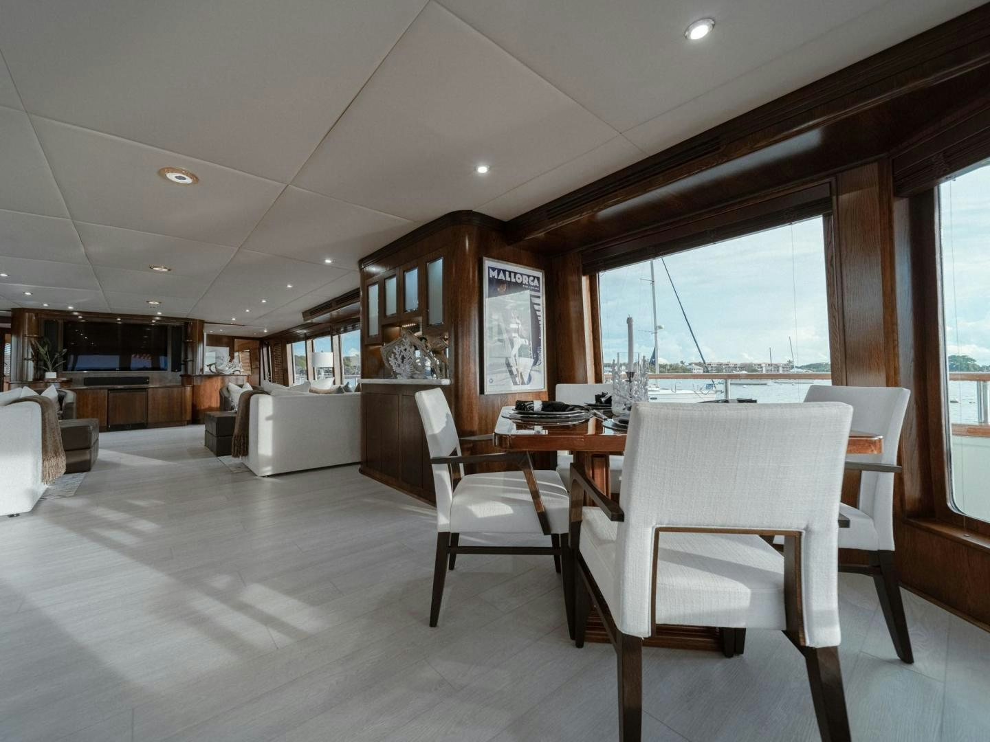a large kitchen with a dining table aboard SKY Yacht for Sale