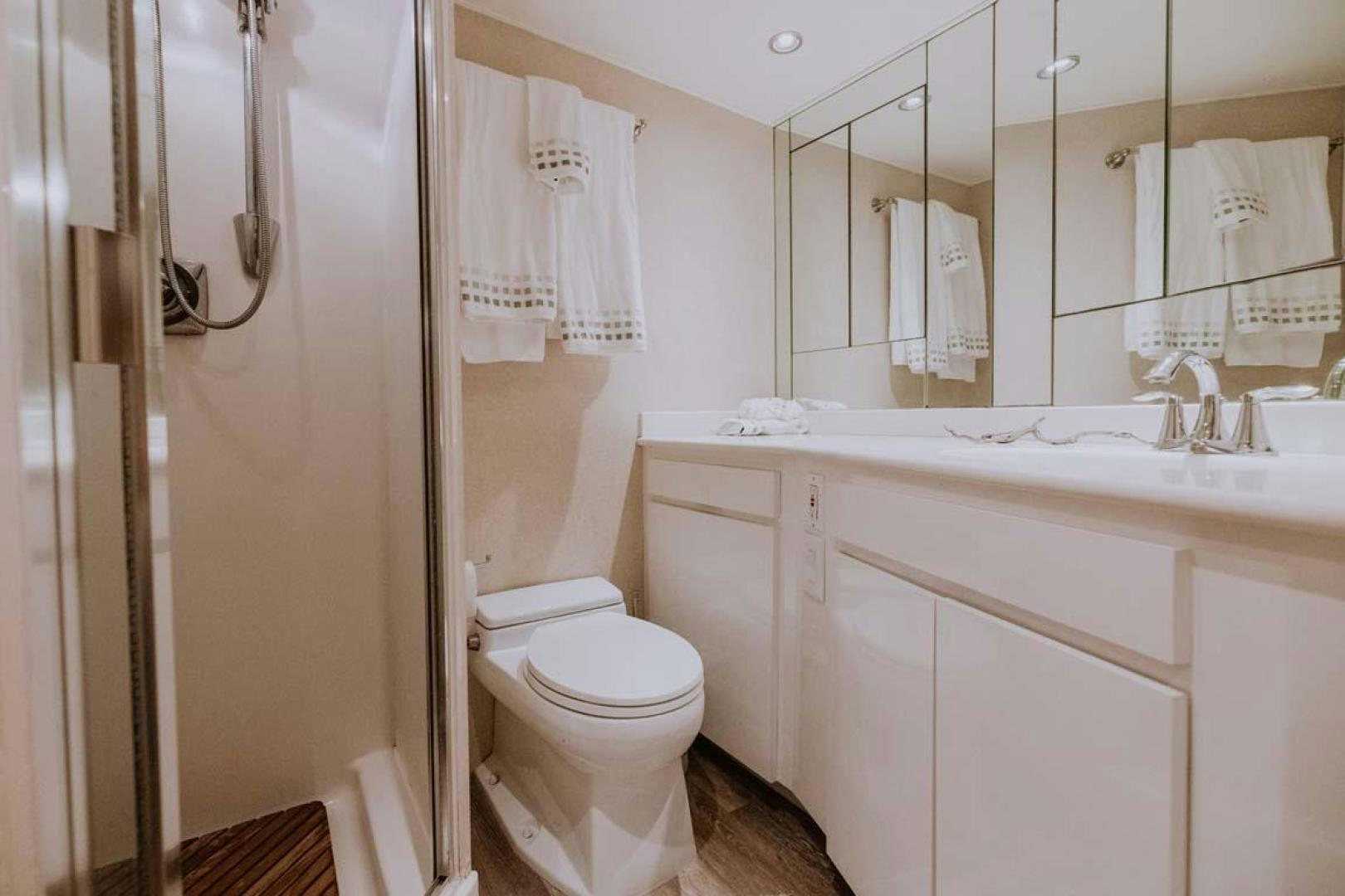a bathroom with a sink toilet and a bathtub aboard SKY Yacht for Sale