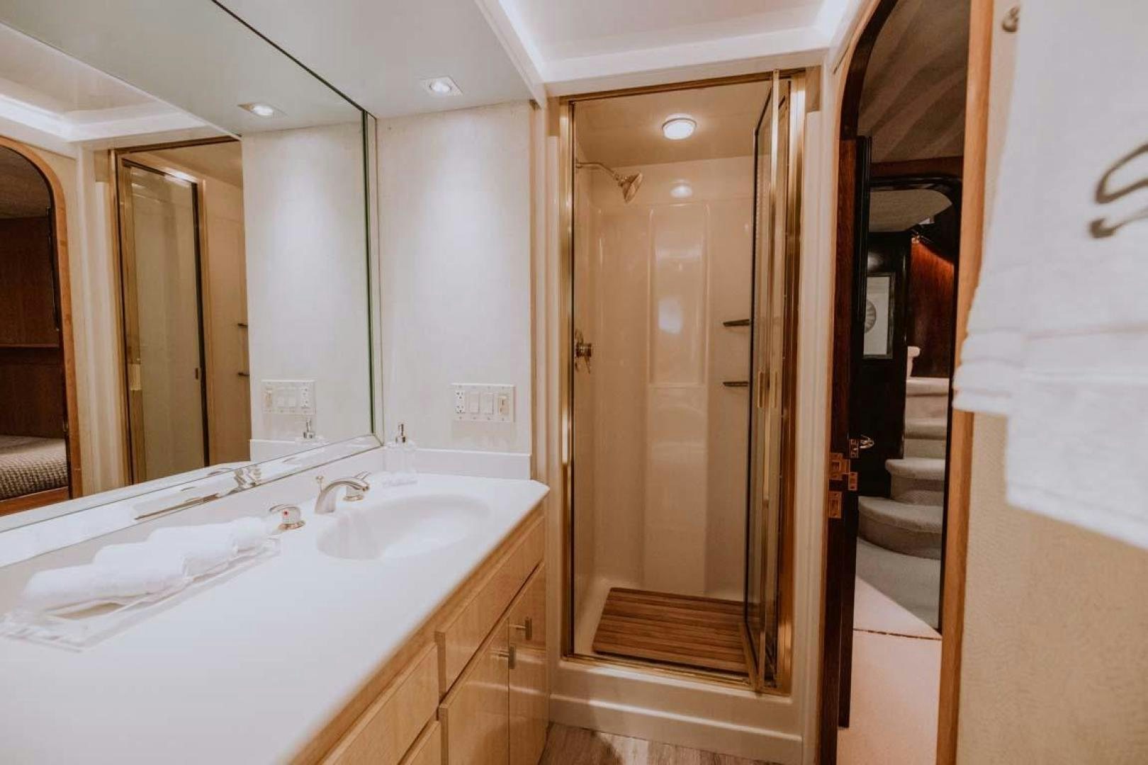 a bathroom with a large mirror aboard SKY Yacht for Sale