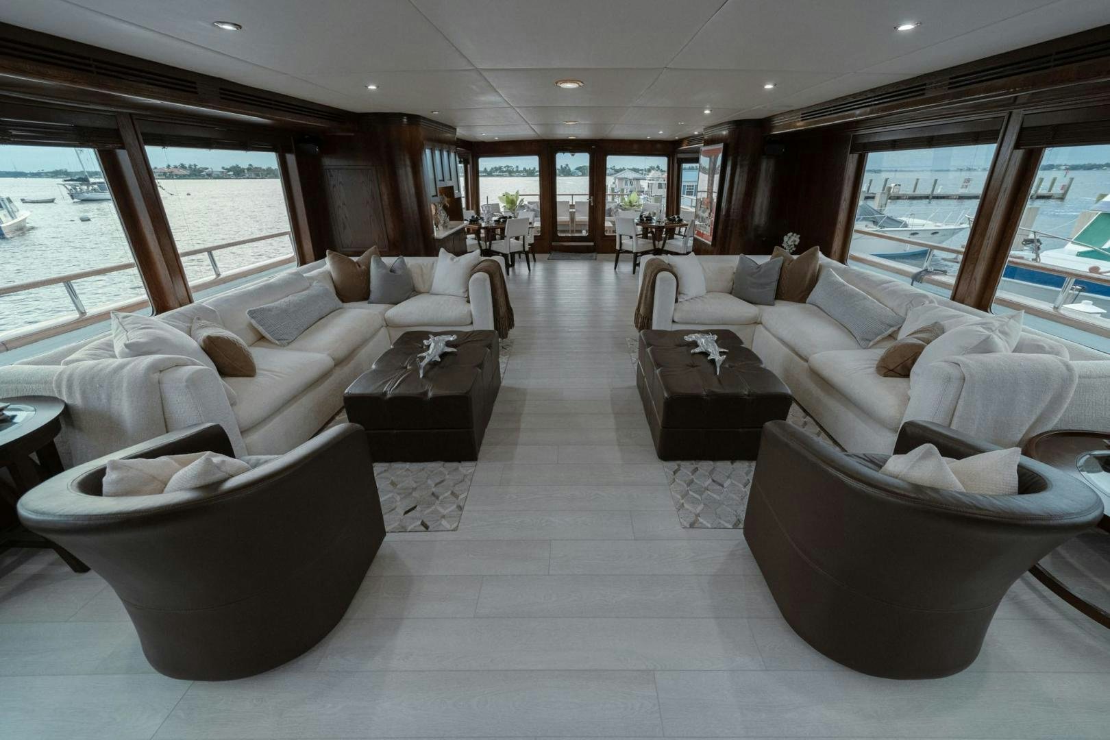 a large living room with a large window aboard SKY Yacht for Sale