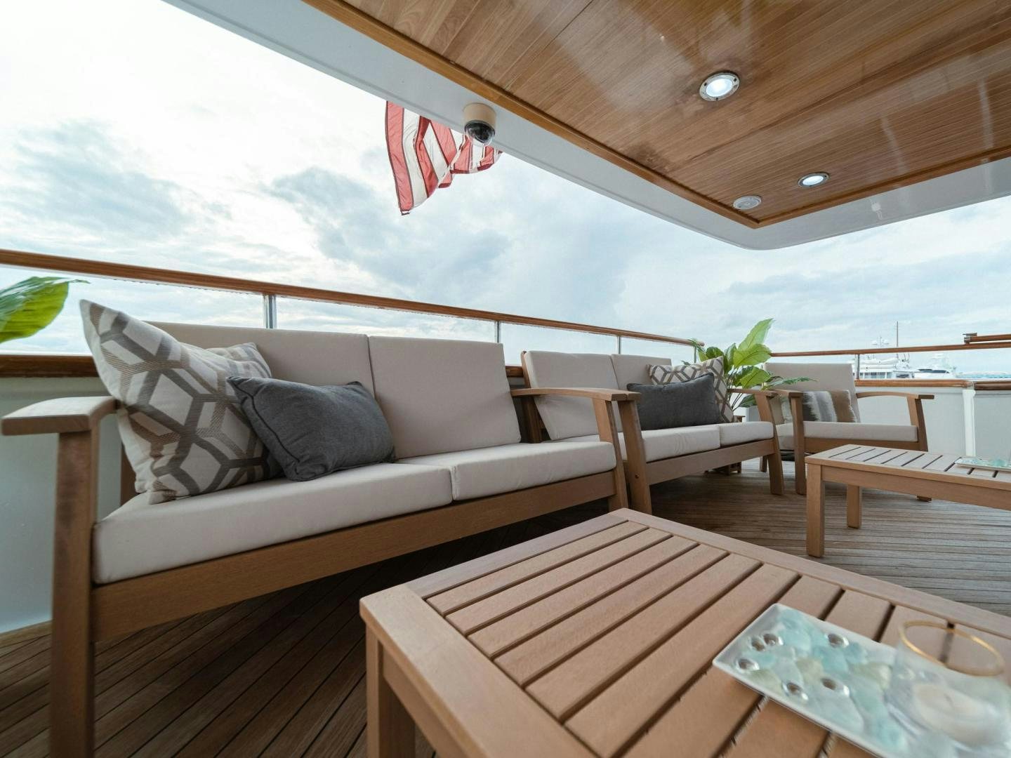 a room with a couch and a table and chairs aboard SKY Yacht for Sale