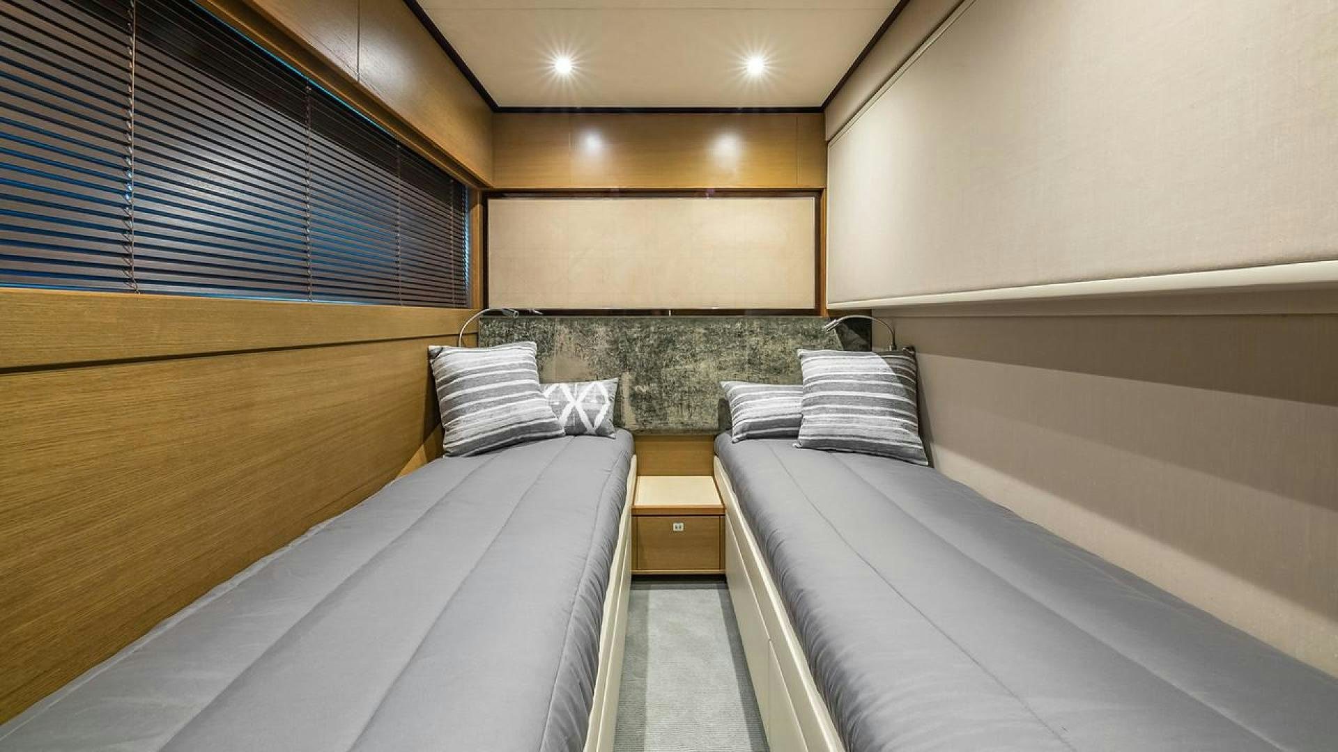 a room with bunk beds aboard FREEDOM Yacht for Sale