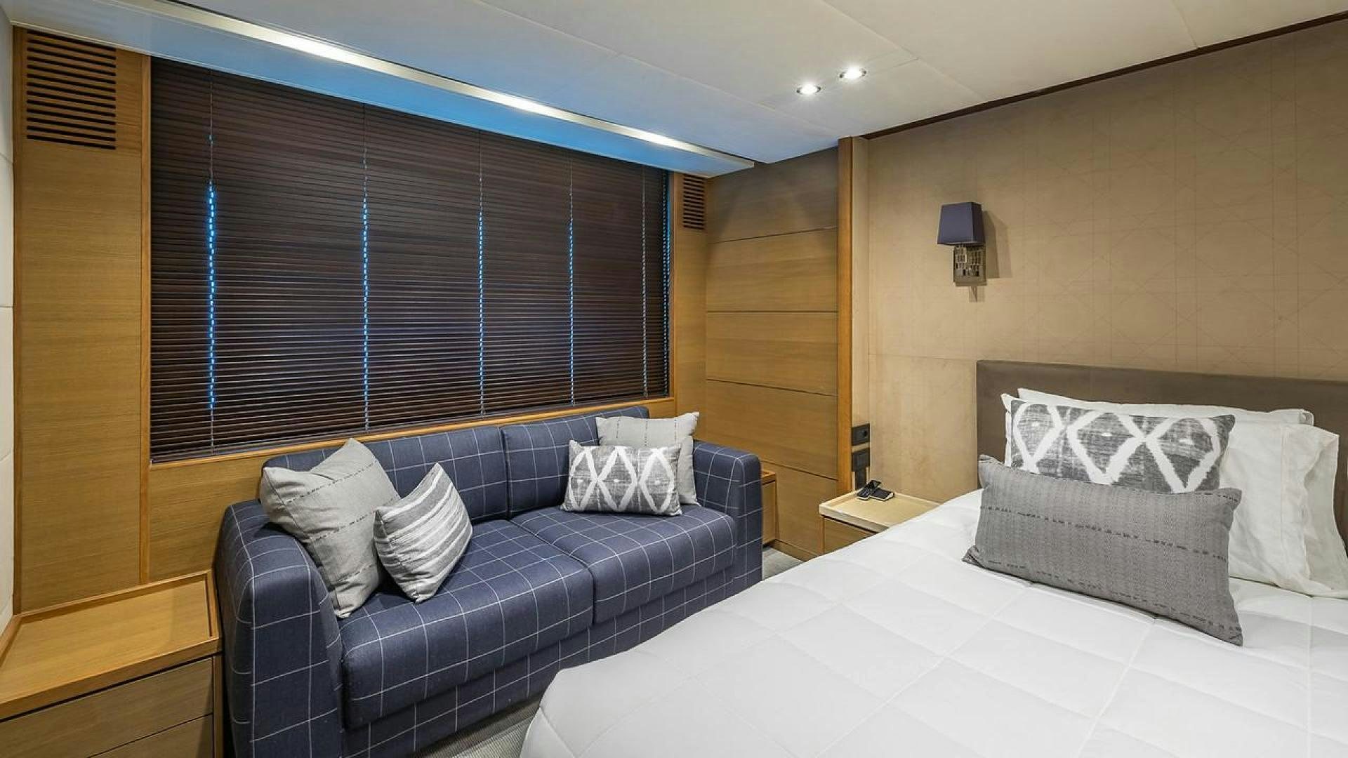 a bed in a room aboard FREEDOM Yacht for Sale