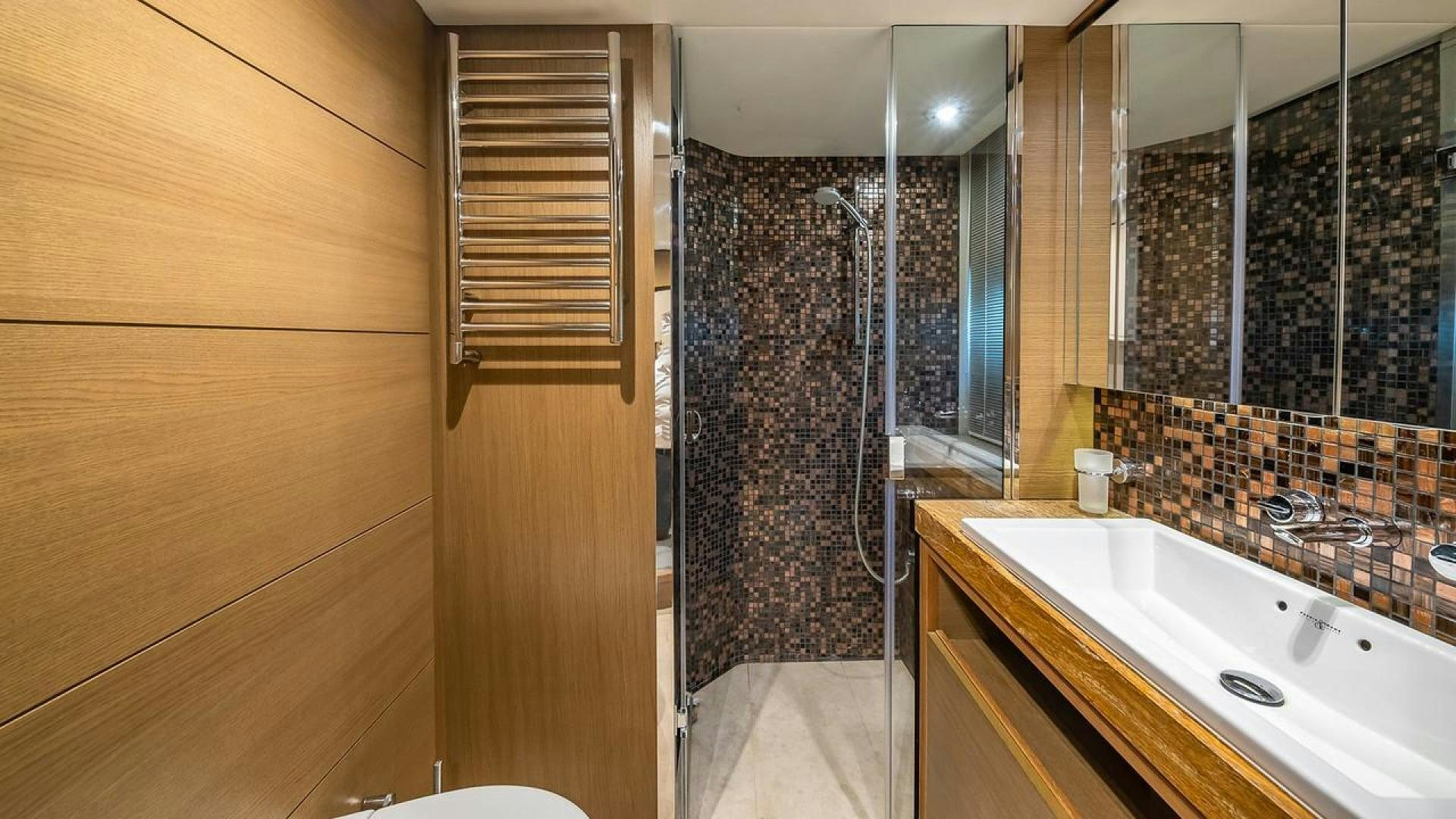 a bathroom with a sink and a shower aboard FREEDOM Yacht for Sale