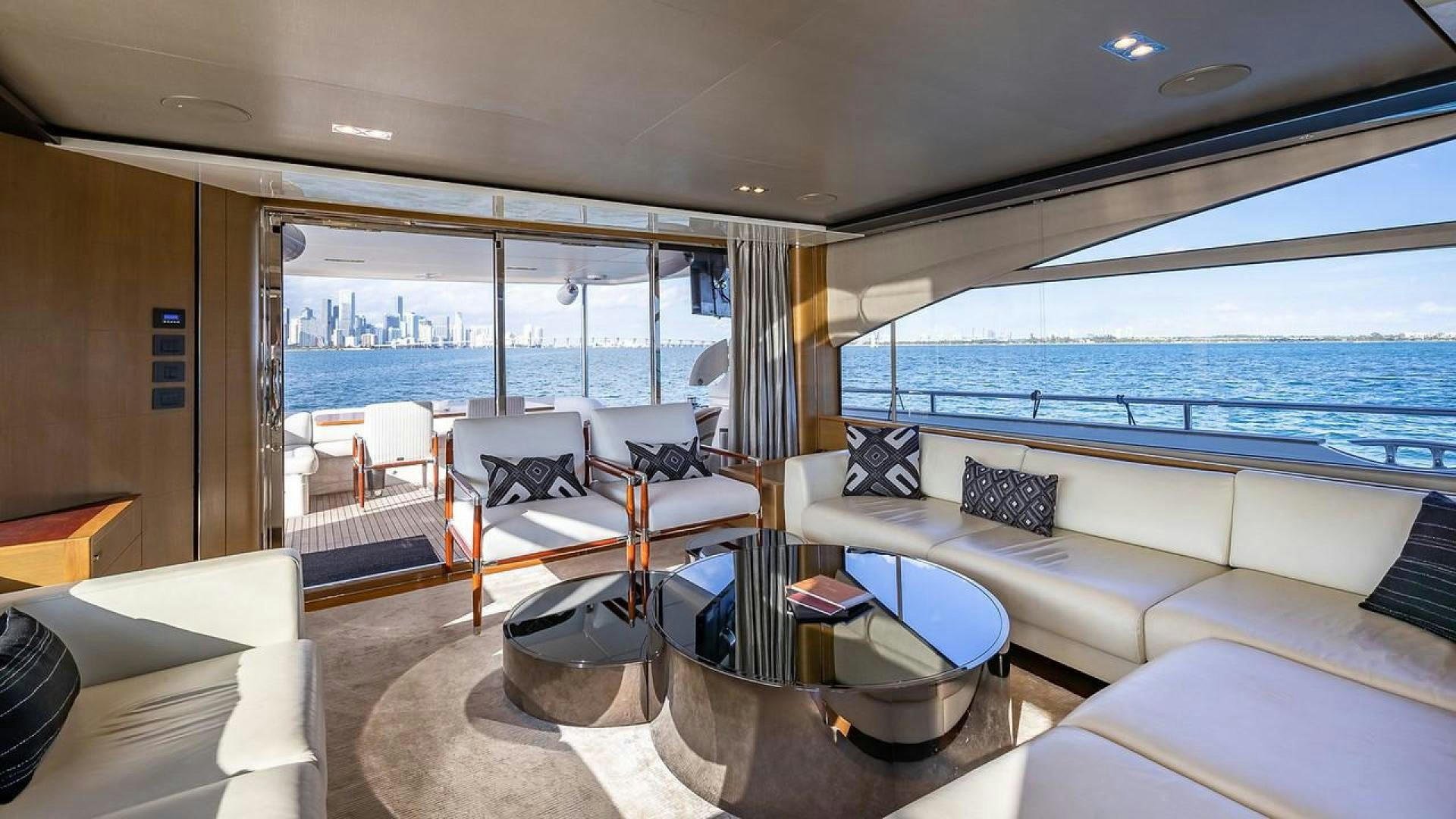a living room with a large window aboard FREEDOM Yacht for Sale