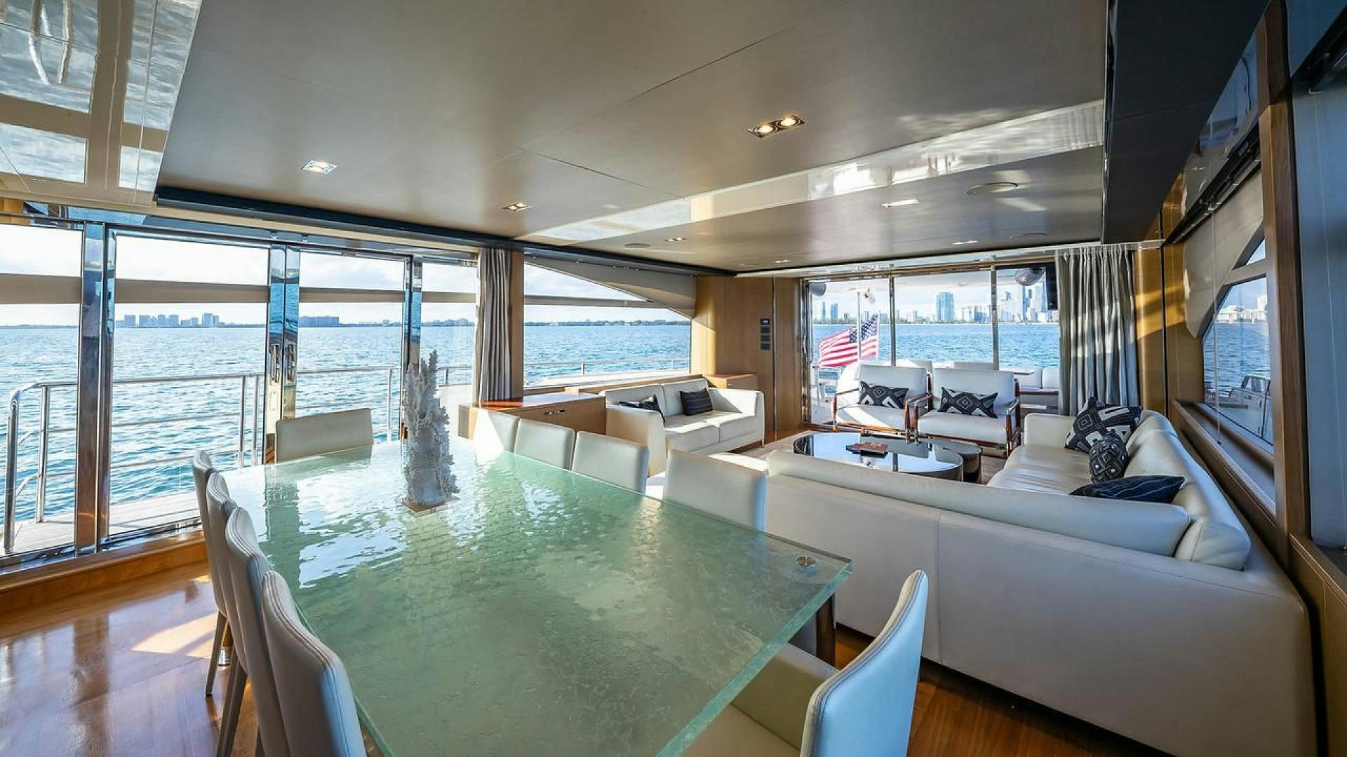 a living room with a large glass window aboard FREEDOM Yacht for Sale