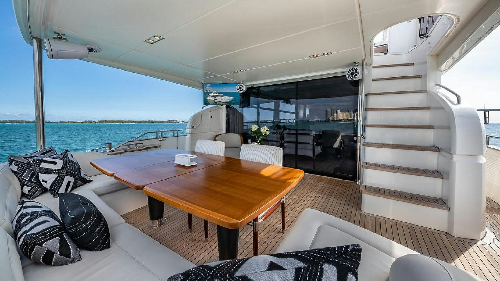 a room with a table and chairs aboard FREEDOM Yacht for Sale