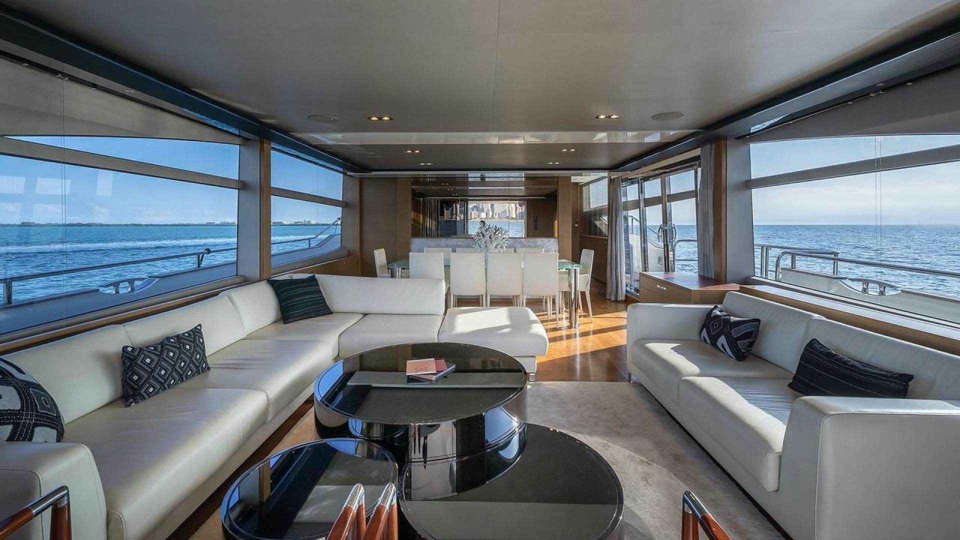 a living room with a large window aboard FREEDOM Yacht for Sale