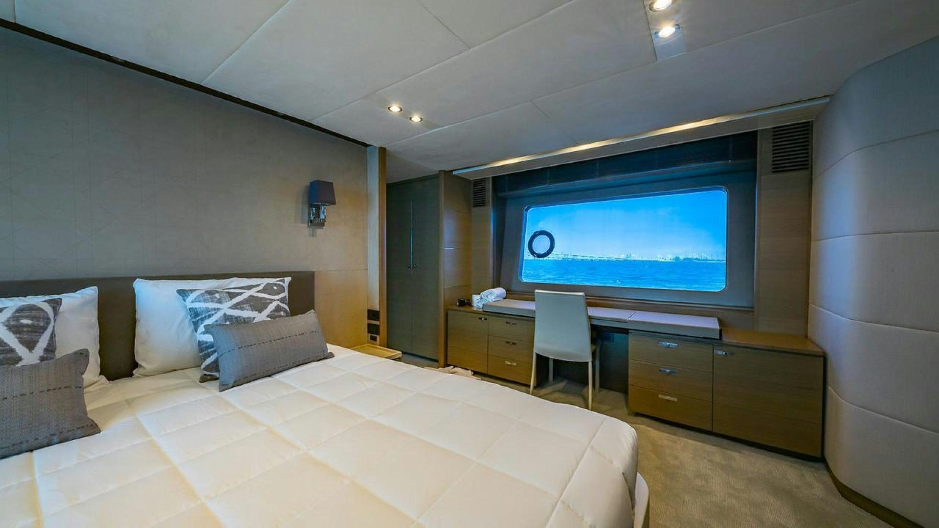 a hotel room with a bed and a tv aboard FREEDOM Yacht for Sale
