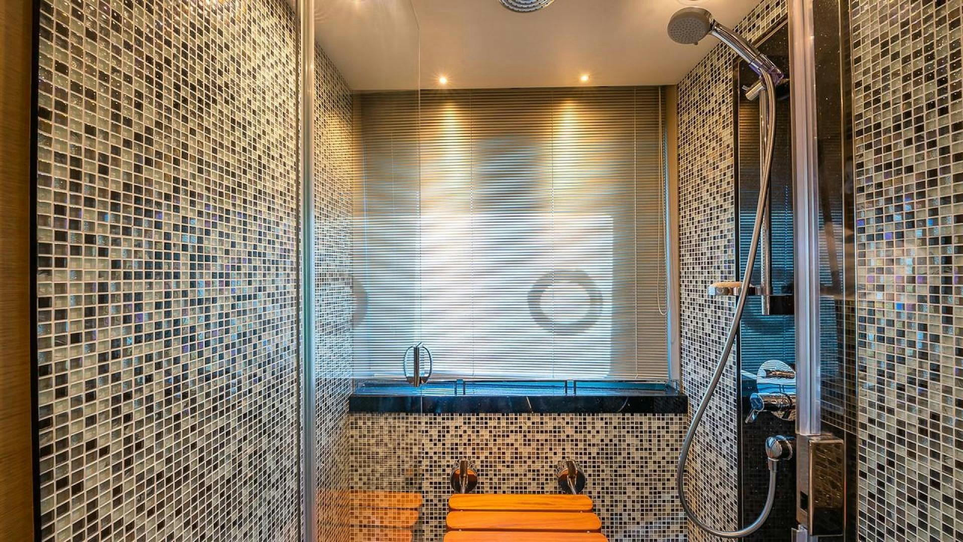 a shower with a shower curtain aboard FREEDOM Yacht for Sale