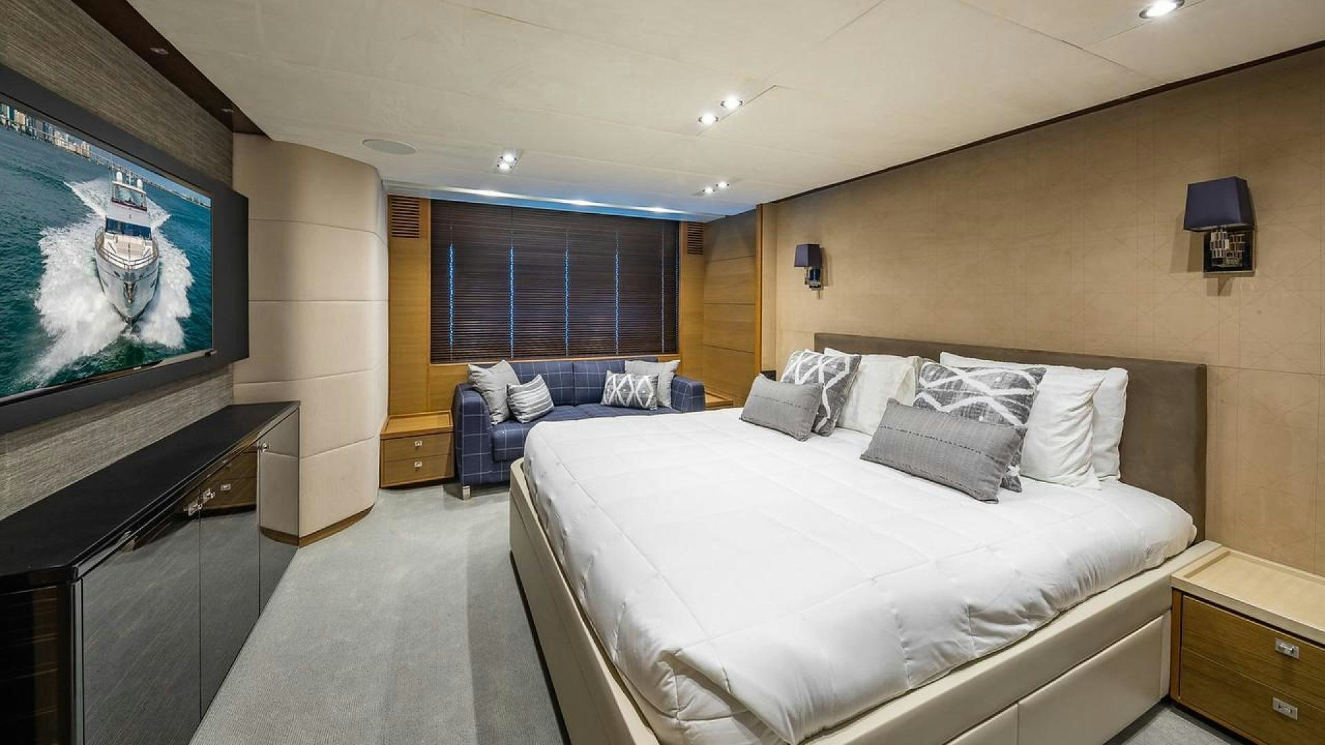 a large bedroom with a large bed aboard FREEDOM Yacht for Sale