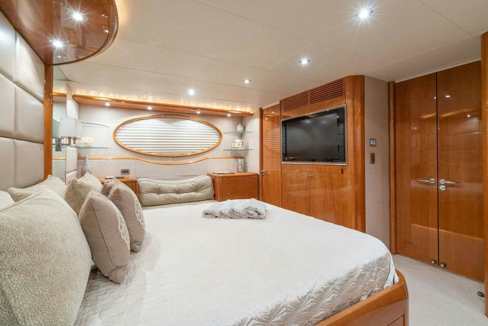 a bedroom with a bed and a television aboard CHIP Yacht for Sale
