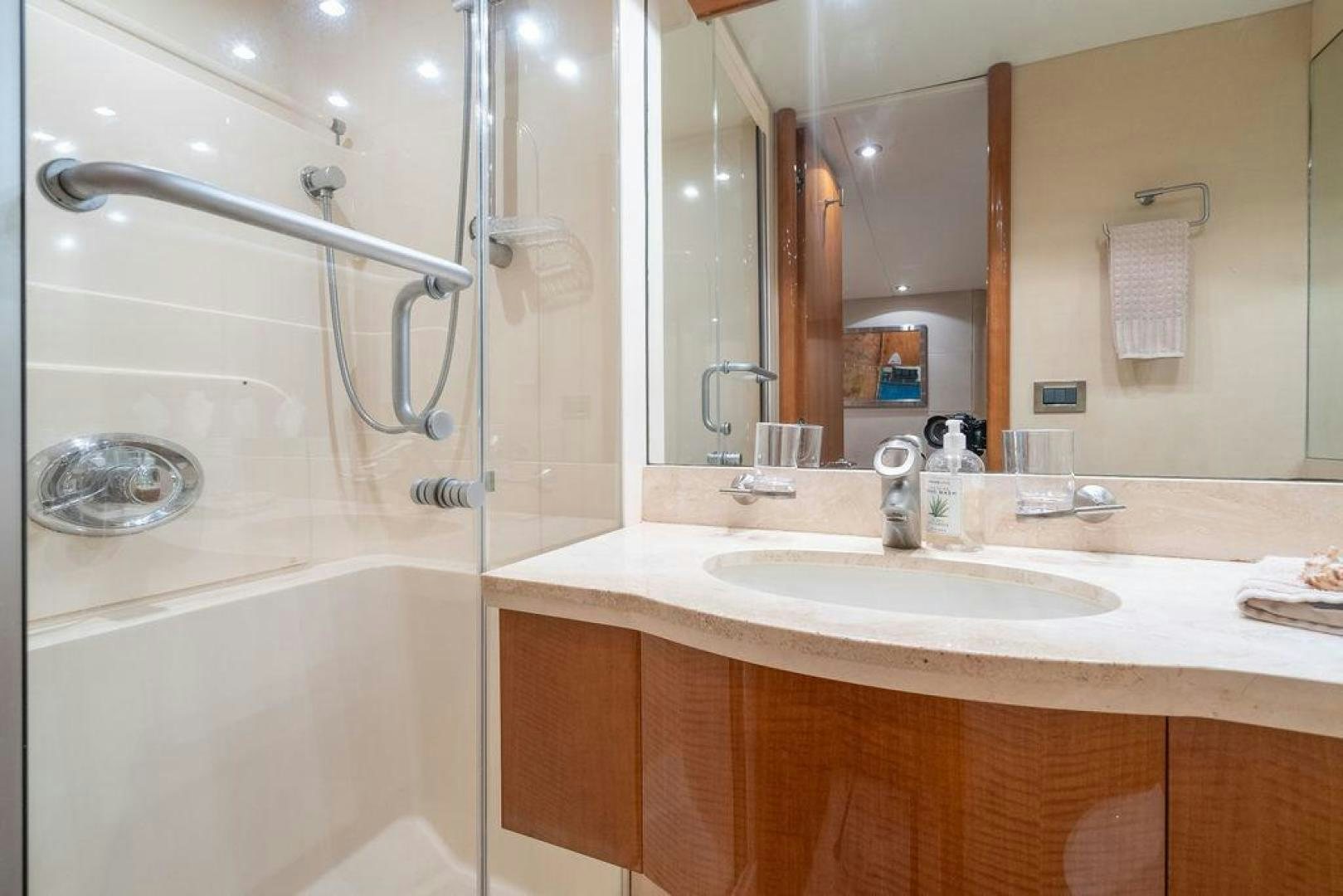 a bathroom with a sink and a shower aboard CHIP Yacht for Sale