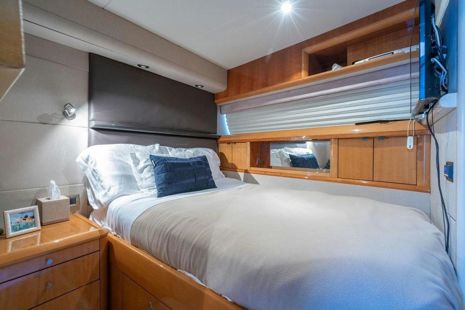 a bedroom with a bed and a desk aboard CHIP Yacht for Sale