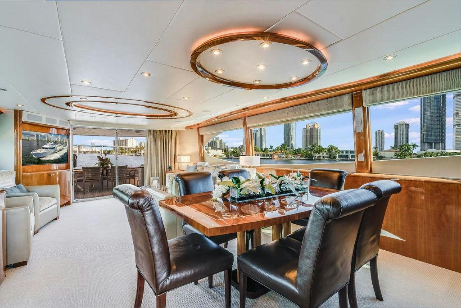 a large dining room with a large window aboard CHIP Yacht for Sale