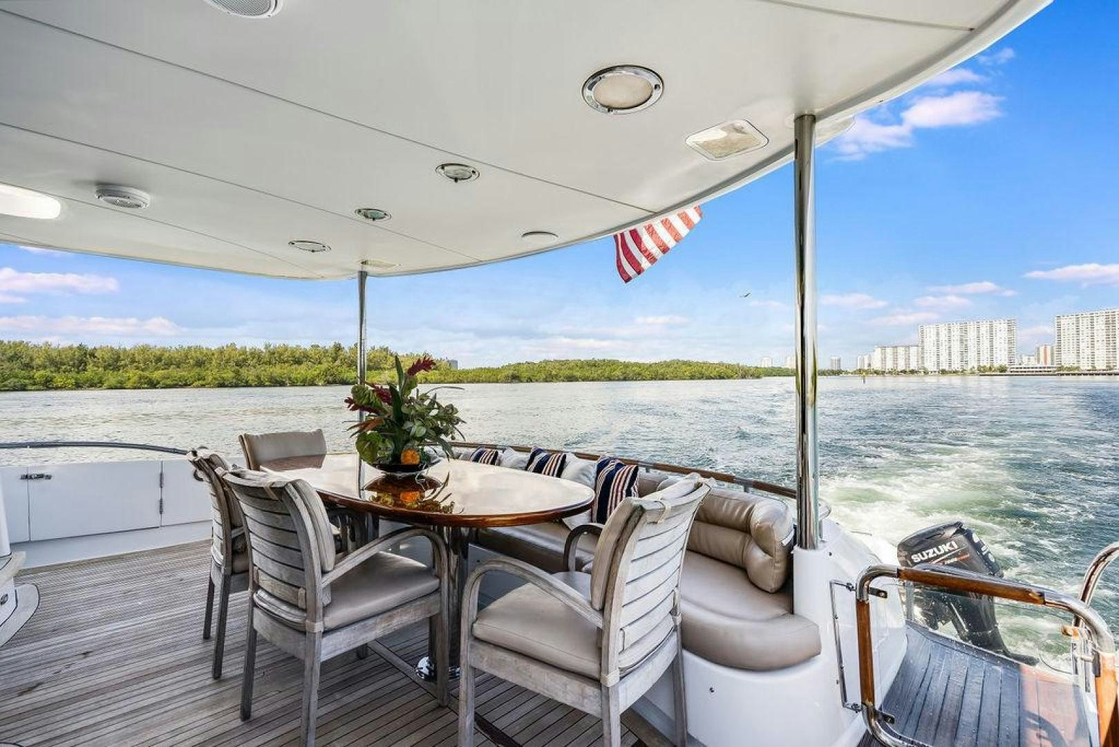 a table and chairs on a boat aboard CHIP Yacht for Sale