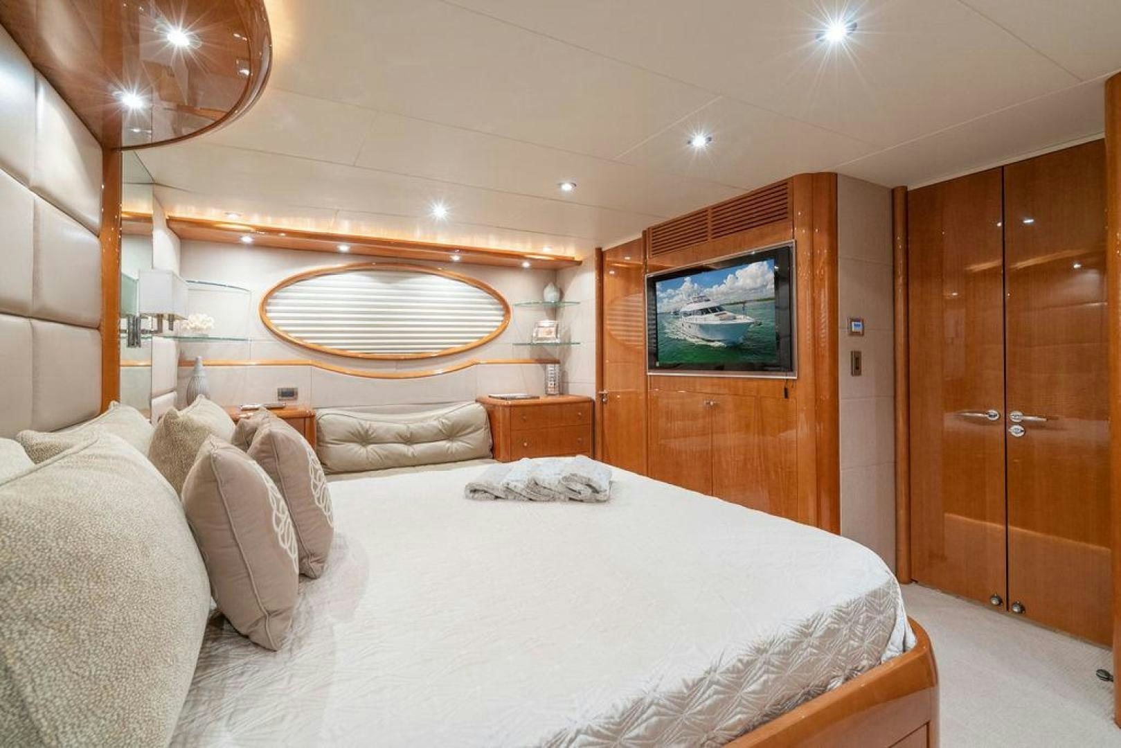 a room with a bed and a television aboard CHIP Yacht for Sale