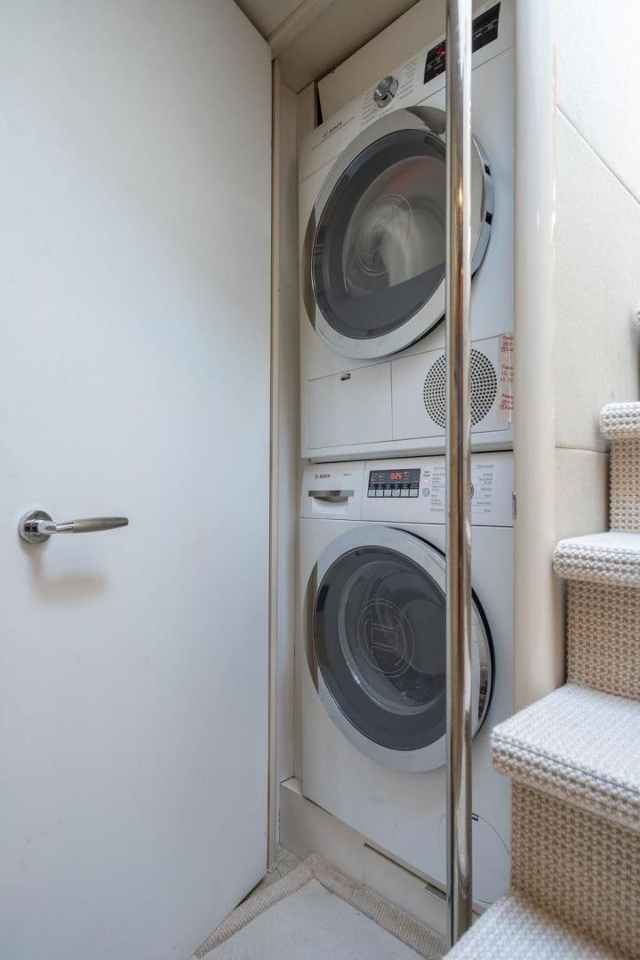 a white washing machine aboard CHIP Yacht for Sale